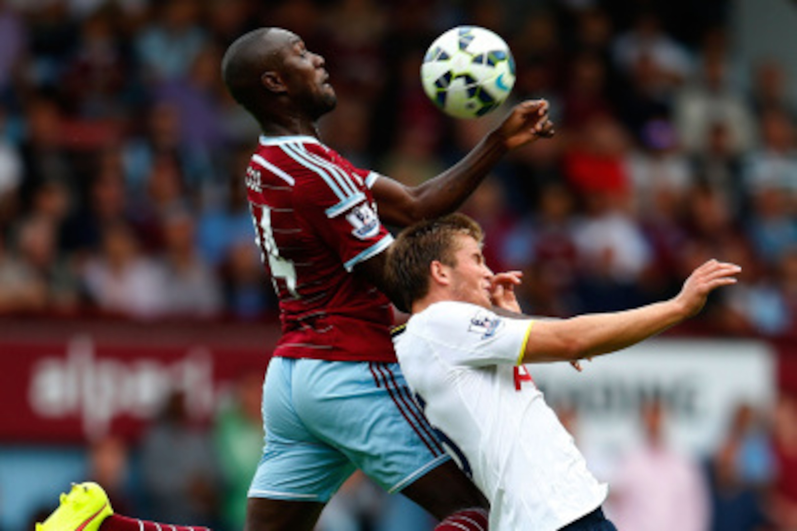 LONDON, ENGLAND - AUGUST 16:  Eric Dier of Tottenham Hotspur is beaten to the ball in the air by Carlton Cole of West Ham during the Barclays Premier League match between West Ham United and Tottenham Hotspur at Boleyn Ground on August 16, 2014 in London,