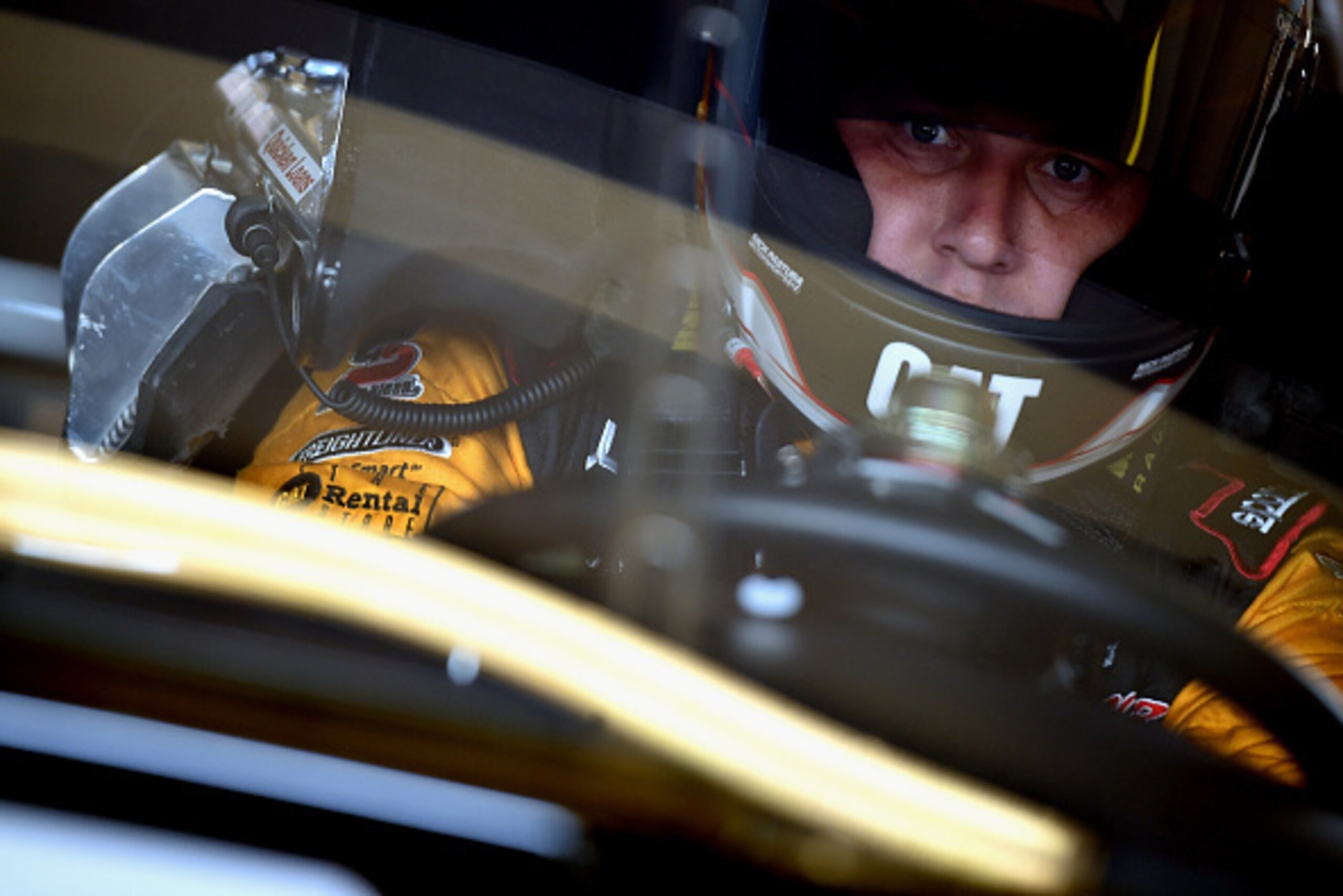 HOMESTEAD, FL - NOVEMBER 14:  Ryan Newman, driver of the #31 Caterpillar Chevrolet, sits in his car in the garage area during practice for the NASCAR Sprint Cup Series Ford EcoBoost 400 at Homestead-Miami Speedway on November 14, 2014 in Homestead, Florid