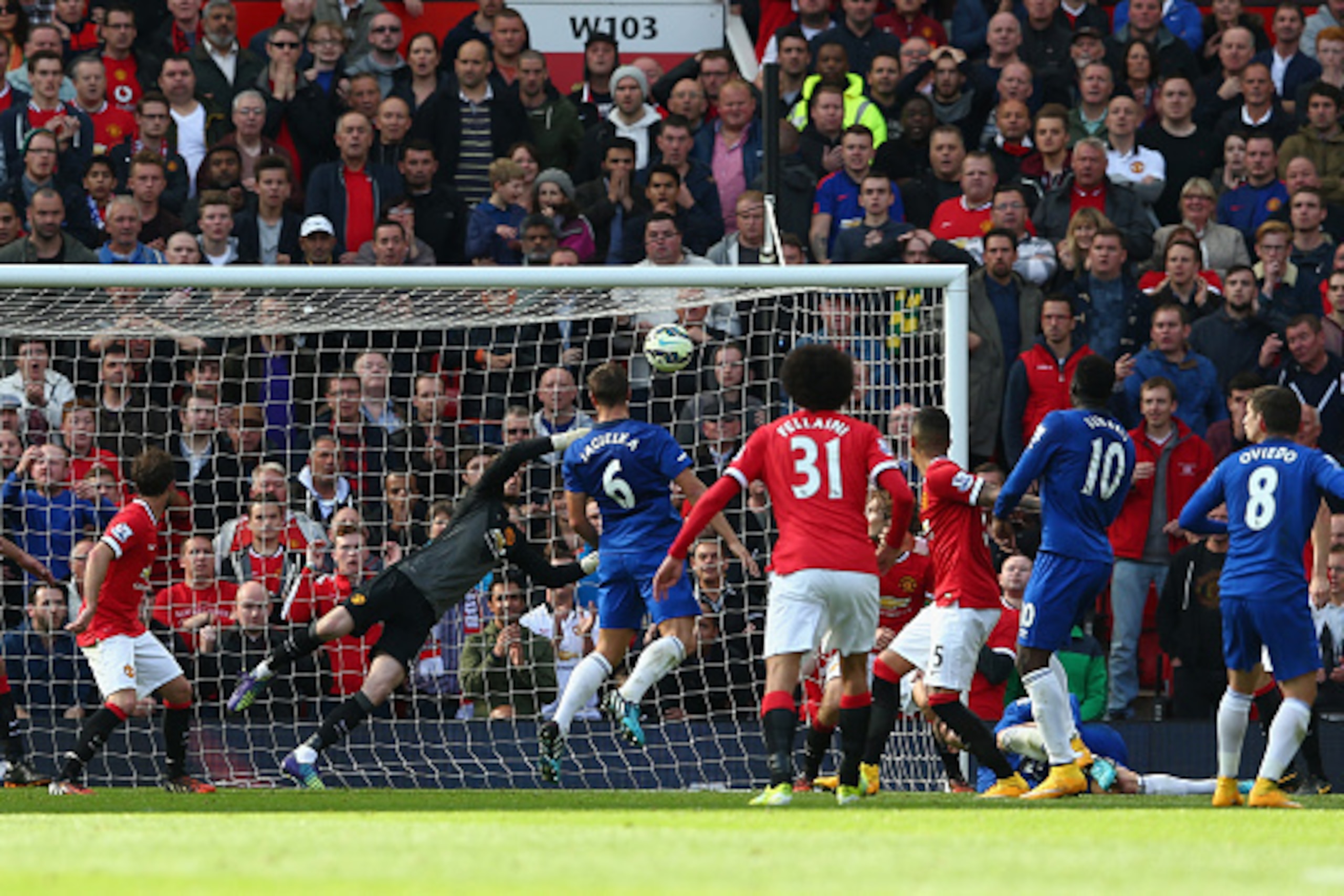 MANCHESTER, ENGLAND - OCTOBER 05:  David De Gea of Manchester United saves the shot of Bryan Oviedo of Everton during the Barclays Premier League match between Manchester United and Everton at Old Trafford on October 5, 2014 in Manchester, England.  (Phot