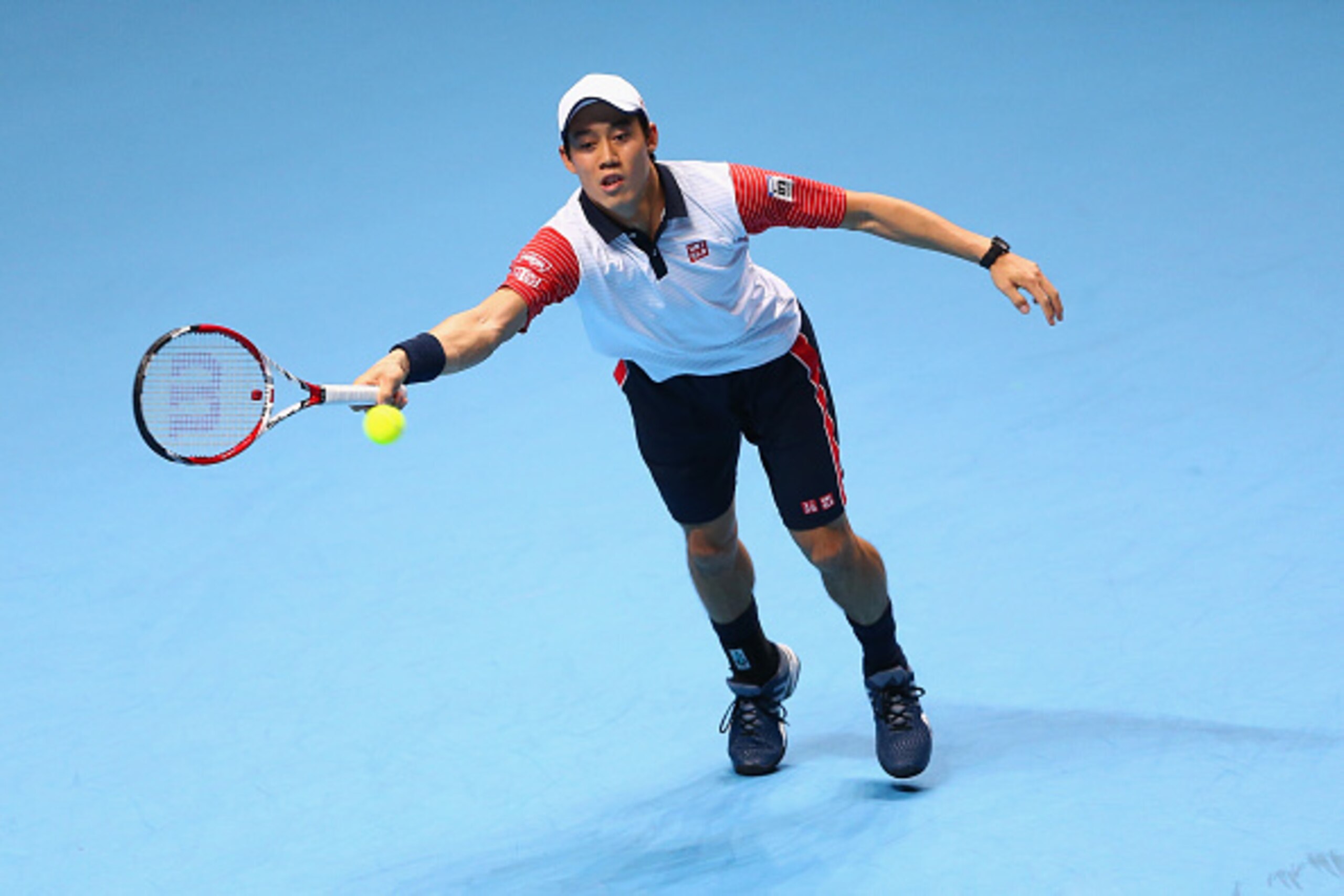 LONDON, ENGLAND - NOVEMBER 15:  Kei Nishikori of Japan plays a forehand in the singles semi-final match against Novak Djokovic of Serbia on day seven of the Barclays ATP World Tour Finals at O2 Arena on November 15, 2014 in London, England.  (Photo by Cli