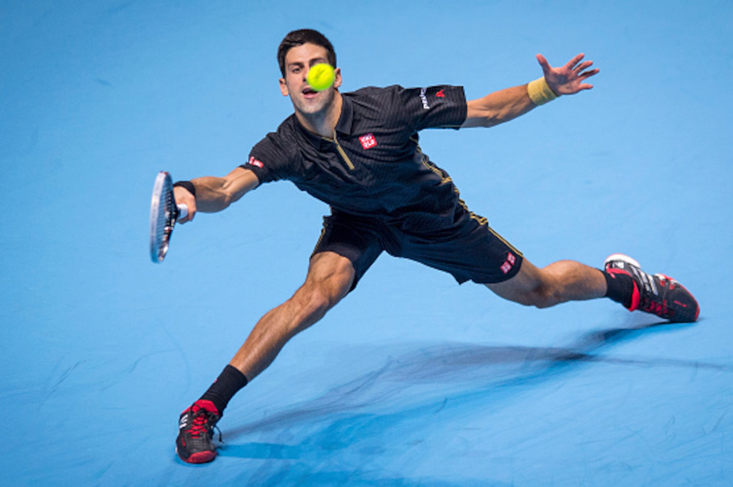 LONDON, ENGLAND - NOVEMBER 15:  Novak Djokovic of Serbia in action during the round robin singles match against Kei Nishikori of Japan on day seven of the Barclays ATP World Tour Finals at O2 Arena on November 15, 2014 in London, England.  (Photo by Justi