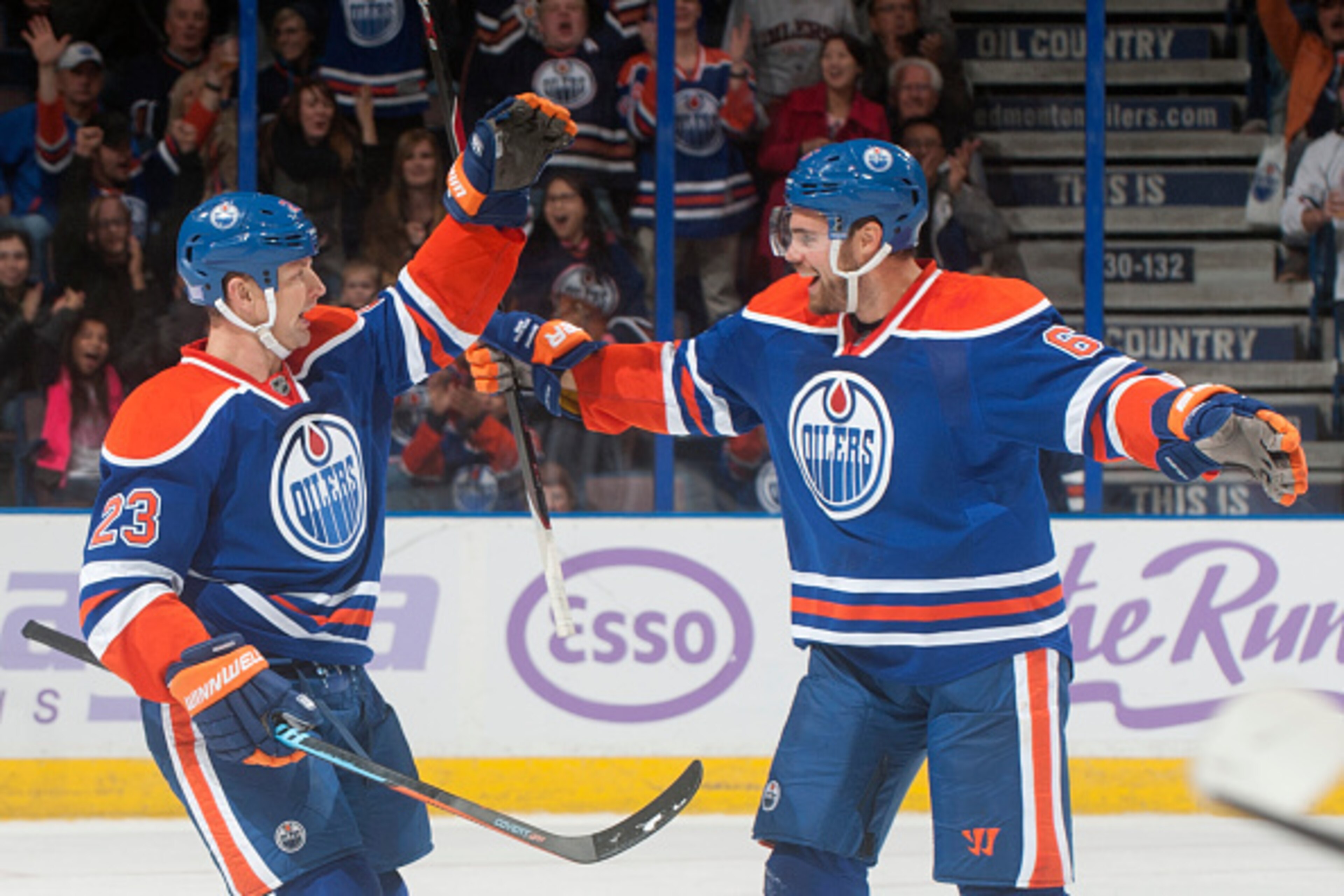EDMONTON, AB - OCTOBER 24: Matt Hendricks #23 and Jesse Joensuu #6 of the Edmonton Oilers celebrate after scoring a goal against the Carolina Hurricanes on October 24, 2014 at Rexall Place in Edmonton, Alberta, Canada. (Photo by Andy Devlin/NHLI via Getty EDMONTON, AB - OCTOBER 24: Matt Hendricks #23 and Jesse Joensuu #6 of the Edmonton Oilers celebrate after scoring a goal against the Carolina Hurricanes on October 24, 2014 at Rexall Place in Edmonton, Alberta, Canada. (Photo by Andy Devlin/NHLI via Getty