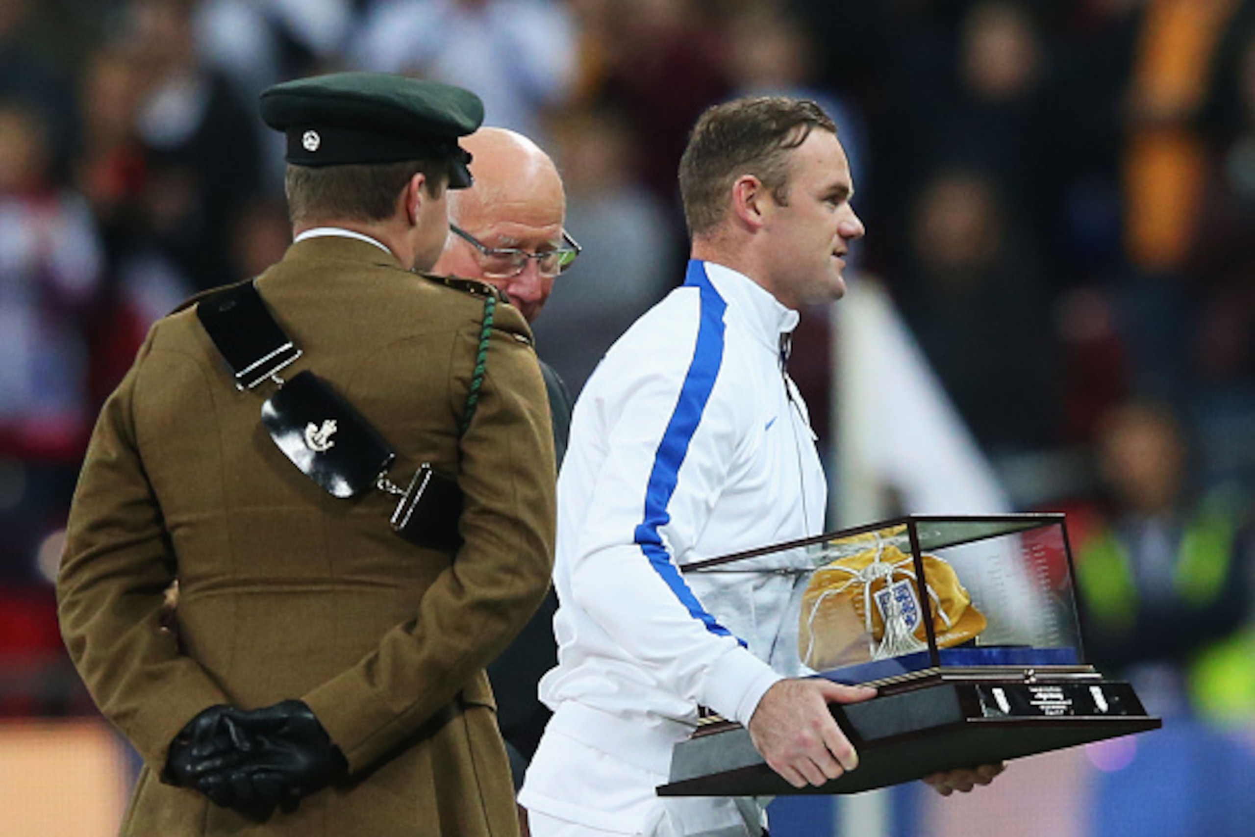 LONDON, ENGLAND - NOVEMBER 15:  Wayne Rooney of England leaves with  his 100th cap after being presented with it by Sir Bobby Charlton prior to  during the EURO 2016 Qualifier Group E match between England and Slovenia at Wembley Stadium on November 15, 2