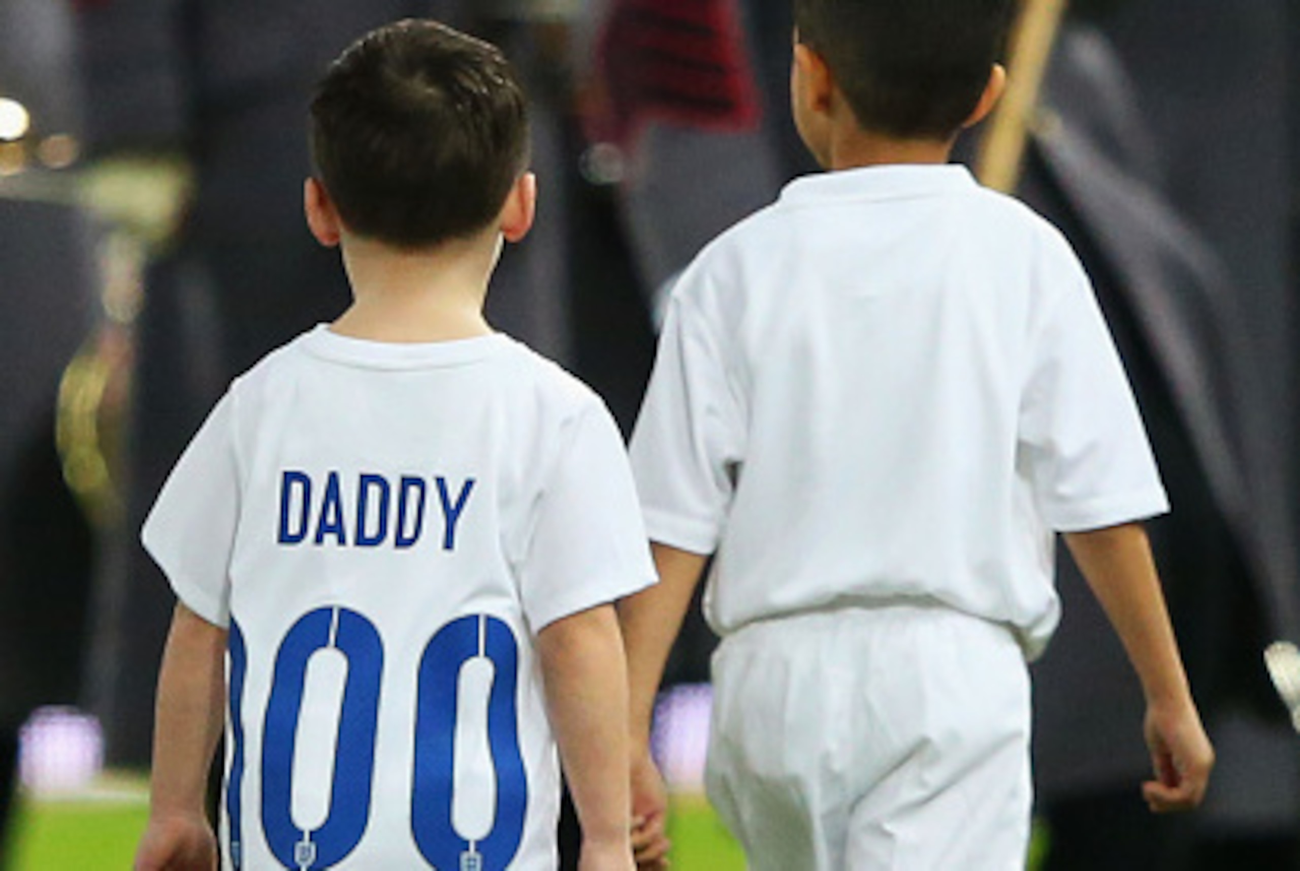 LONDON, ENGLAND - NOVEMBER 15:  Kai Rooney wears a shirt with 'Daddy 100' to commemorate Wayne Rooney of England's 100th cap prior to during the EURO 2016 Qualifier Group E match between England and Slovenia at Wembley Stadium on November 15, 2014 in Lond