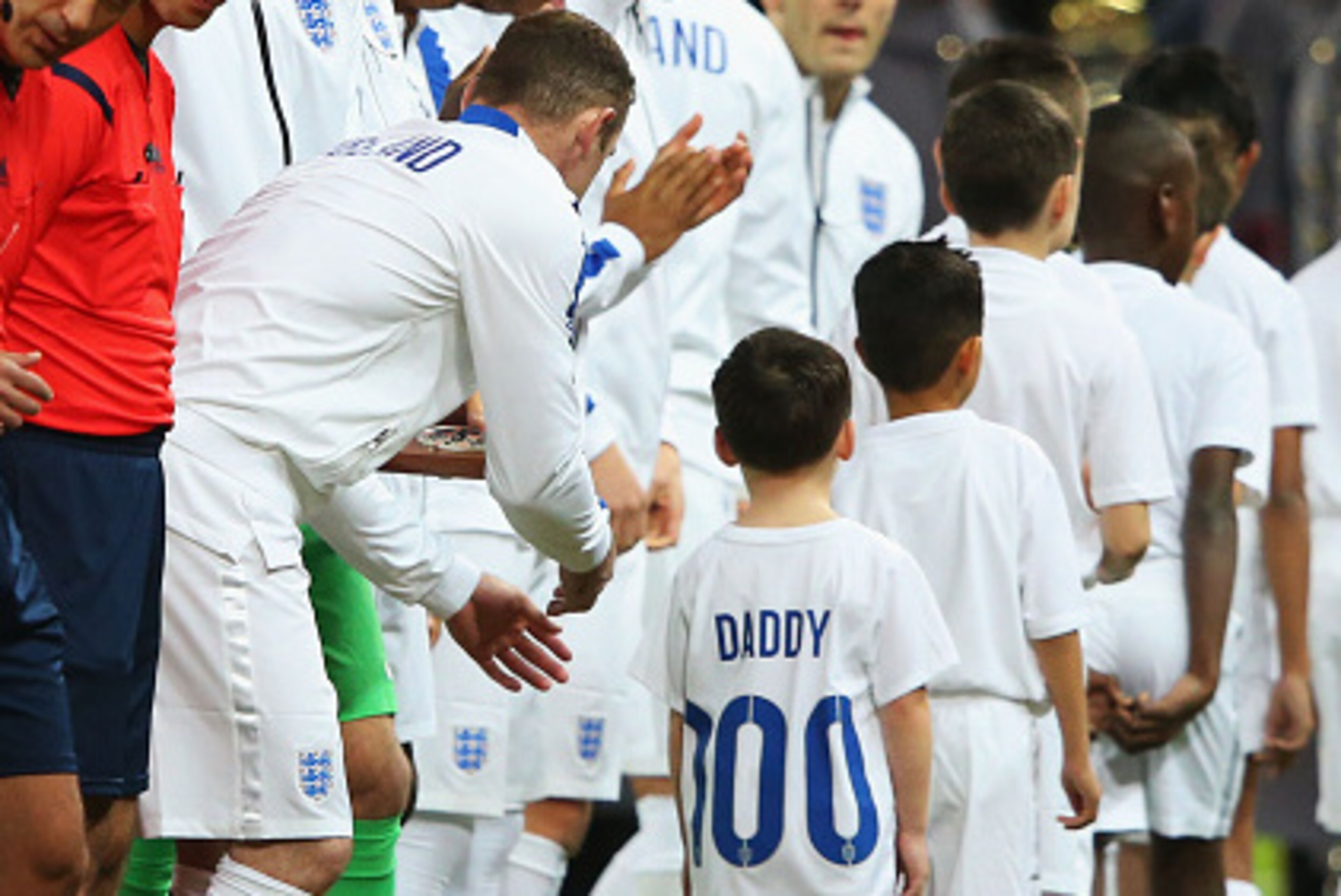 LONDON, ENGLAND - NOVEMBER 15: Kai Rooney wears a shirt with 'Daddy 100' to commemorate Wayne Rooney of England's 100th cap prior to during the EURO 2016 Qualifier Group E match between England and Slovenia at Wembley Stadium on November 15, 2014 in Lond LONDON, ENGLAND - NOVEMBER 15: Kai Rooney wears a shirt with 'Daddy 100' to commemorate Wayne Rooney of England's 100th cap prior to during the EURO 2016 Qualifier Group E match between England and Slovenia at Wembley Stadium on November 15, 2014 in Lond