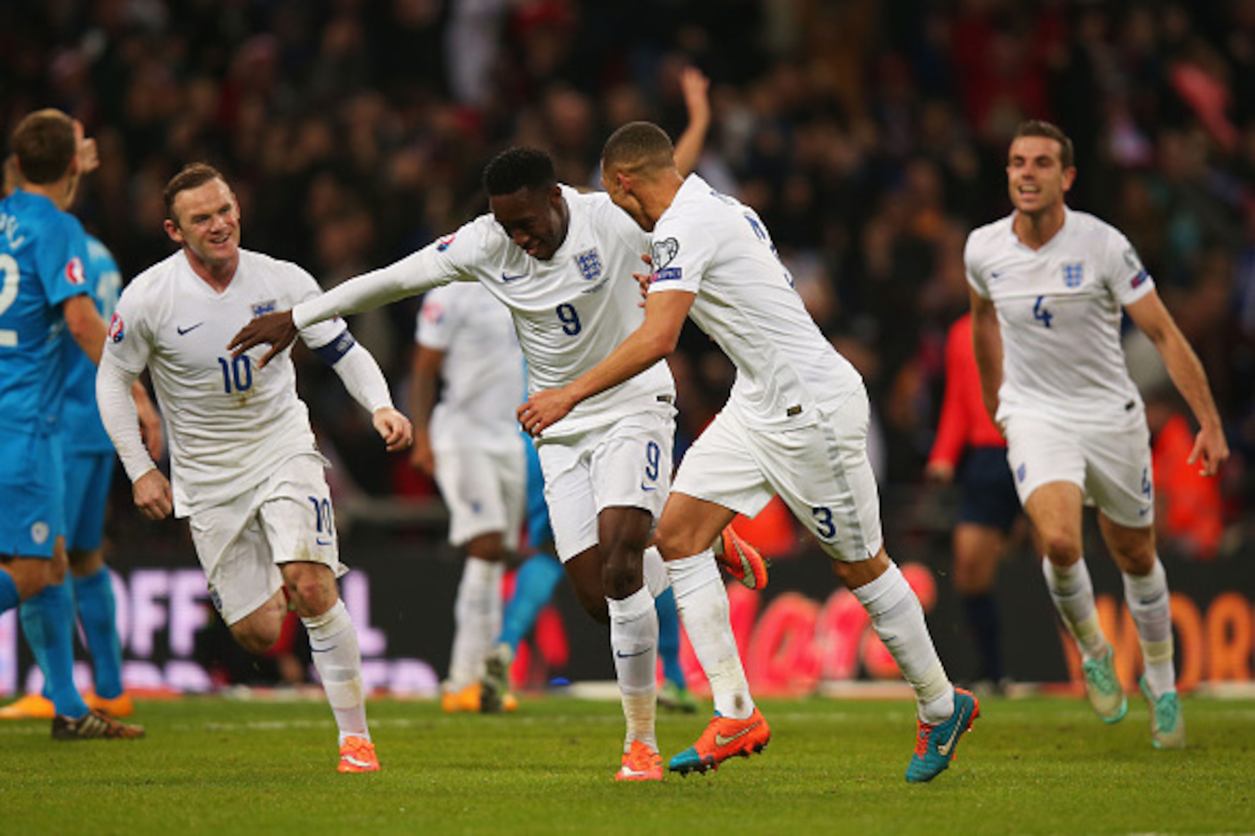 LONDON, ENGLAND - NOVEMBER 15:  Danny Welbeck of England (9) celebrates with team mates as he scores their second goal during the EURO 2016 Qualifier Group E match between England and Slovenia at Wembley Stadium on November 15, 2014 in London, England.  (