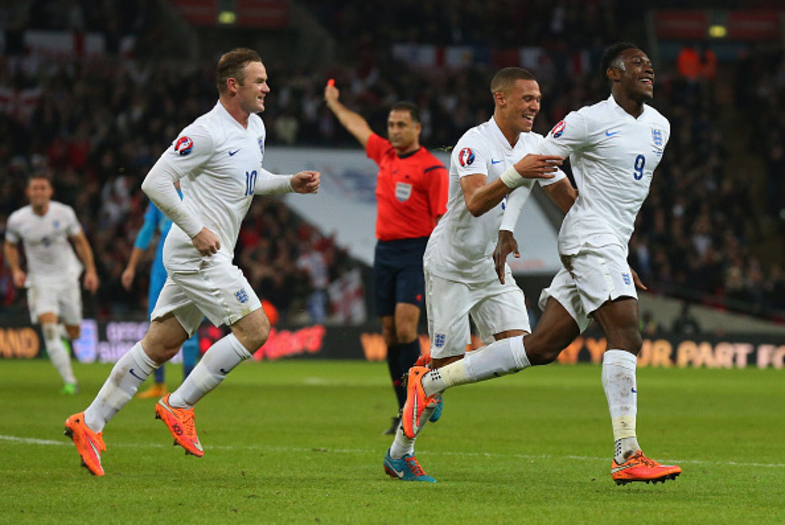 LONDON, ENGLAND - NOVEMBER 15:  Danny Welbeck of England (9) celebrates with team mates Wayne Rooney (10) and Kieran Gibbs (3) as he scores their second goal during the EURO 2016 Qualifier Group E match between England and Slovenia at Wembley Stadium on N