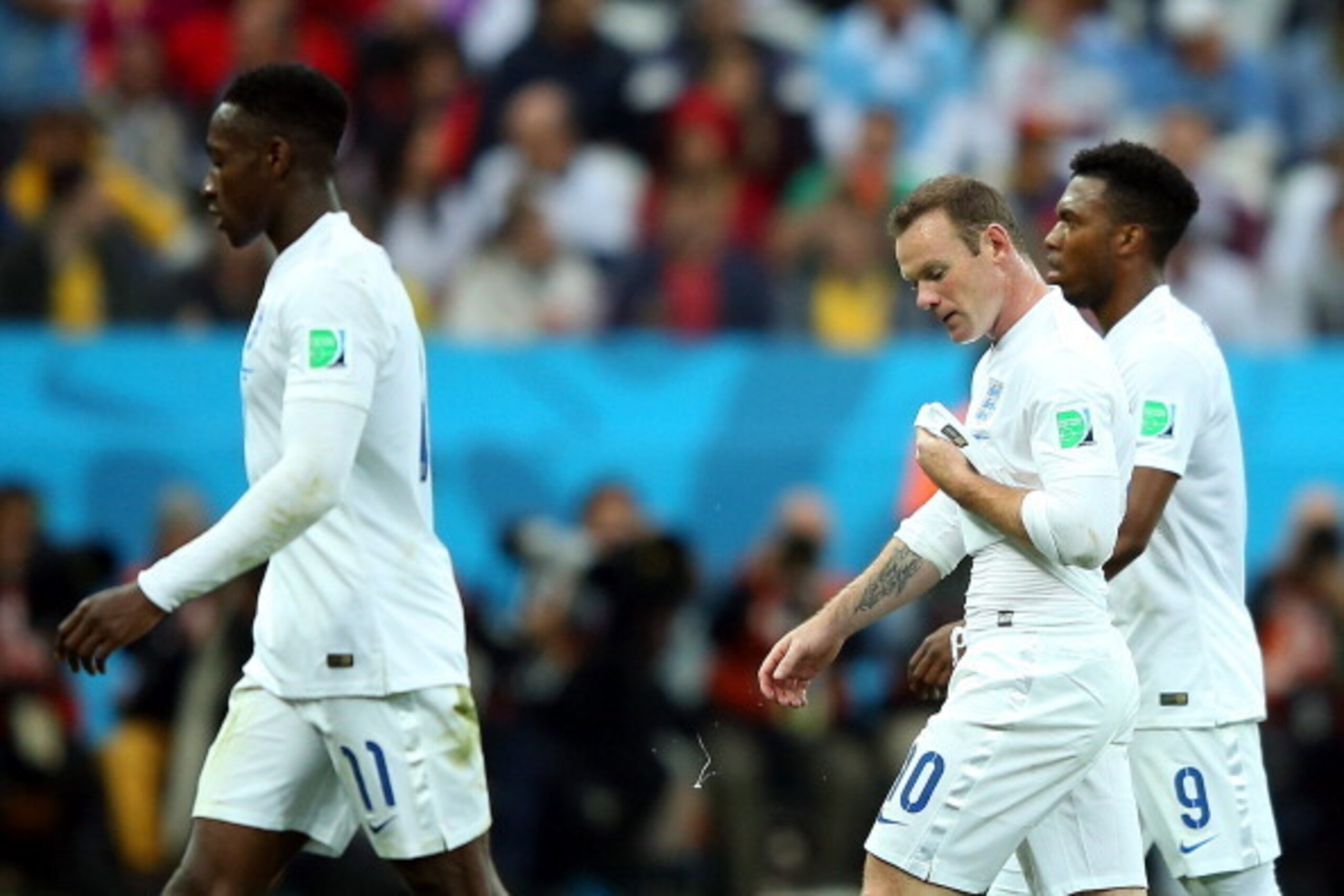 SAO PAULO, BRAZIL - JUNE 19:  (L-R) Danny Welbeck, Wayne Rooney and Daniel Sturridge of England look dejected as they walk off the pitch during the 2014 FIFA World Cup Brazil Group D match between Uruguay and England at Arena de Sao Paulo on June 19, 2014