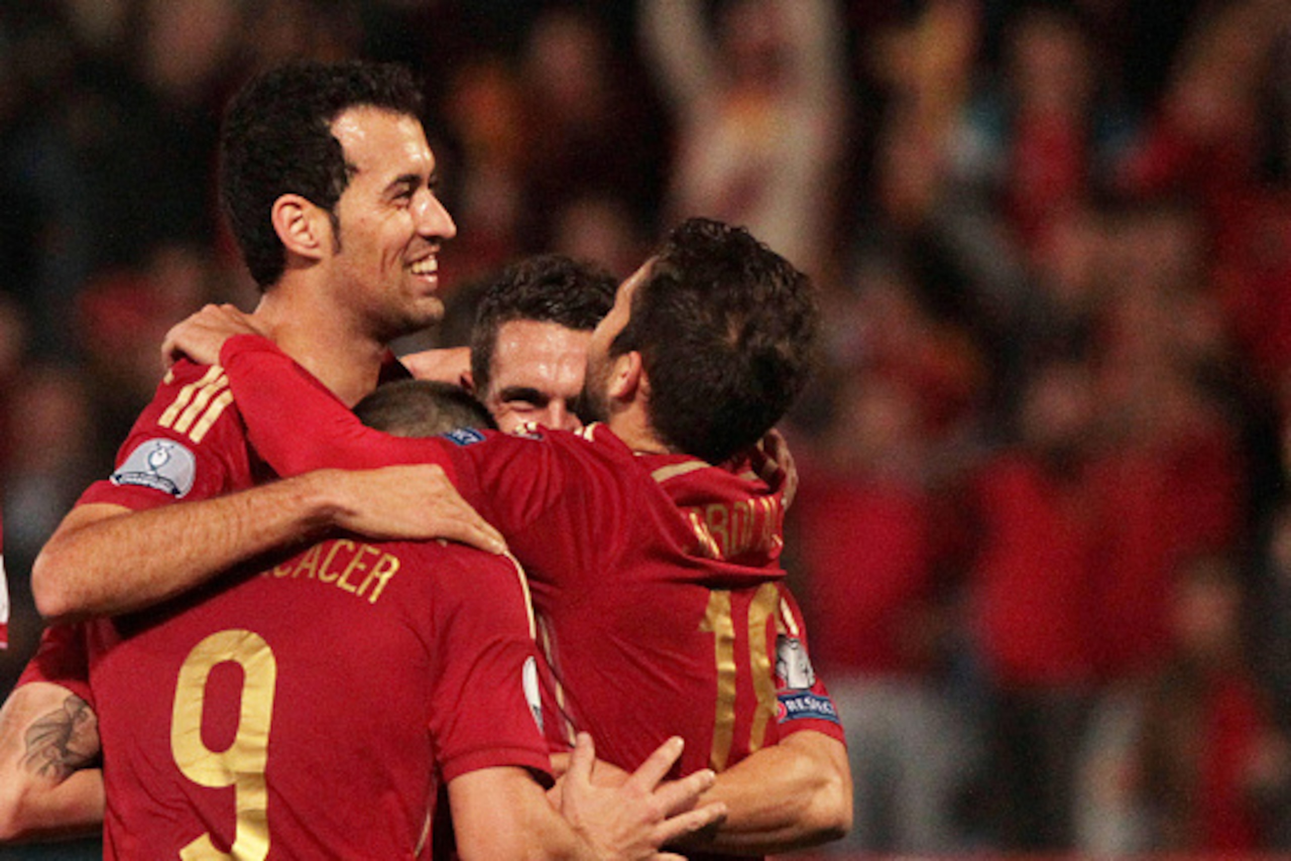 HUELVA, SPAIN - NOVEMBER 15: Sergio Busquets of Spain celebrates with his teammates after scoring during the UEFA EURO 2016 Group C Qualifier football match between Spain and Belarus at Nuevo Colombino studium on November 15, 2014 in Huelva, Spain. (Photo