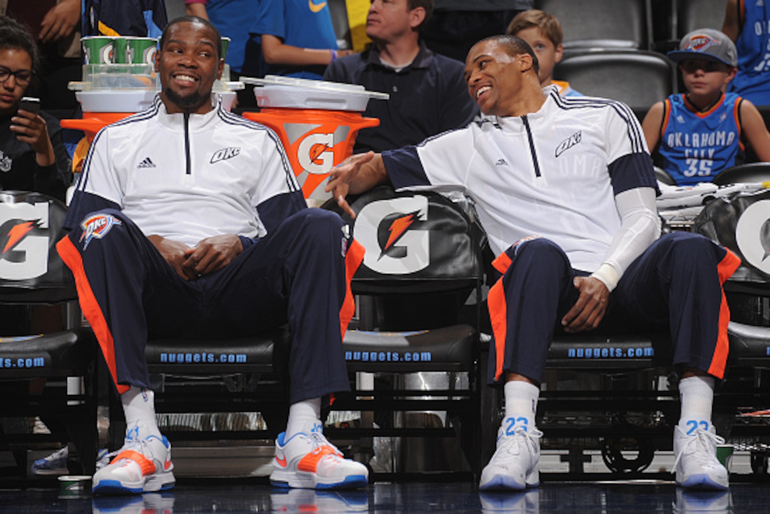DENVER, CO - OCTOBER 8: Kevin Durant #35 and Russell Westbrook #0 of the Oklahoma City Thunder smile during the game against the Denver Nuggets on October 8, 2014 at the Pepsi Center in Denver, Colorado. NOTE TO USER: User expressly acknowledges and agree