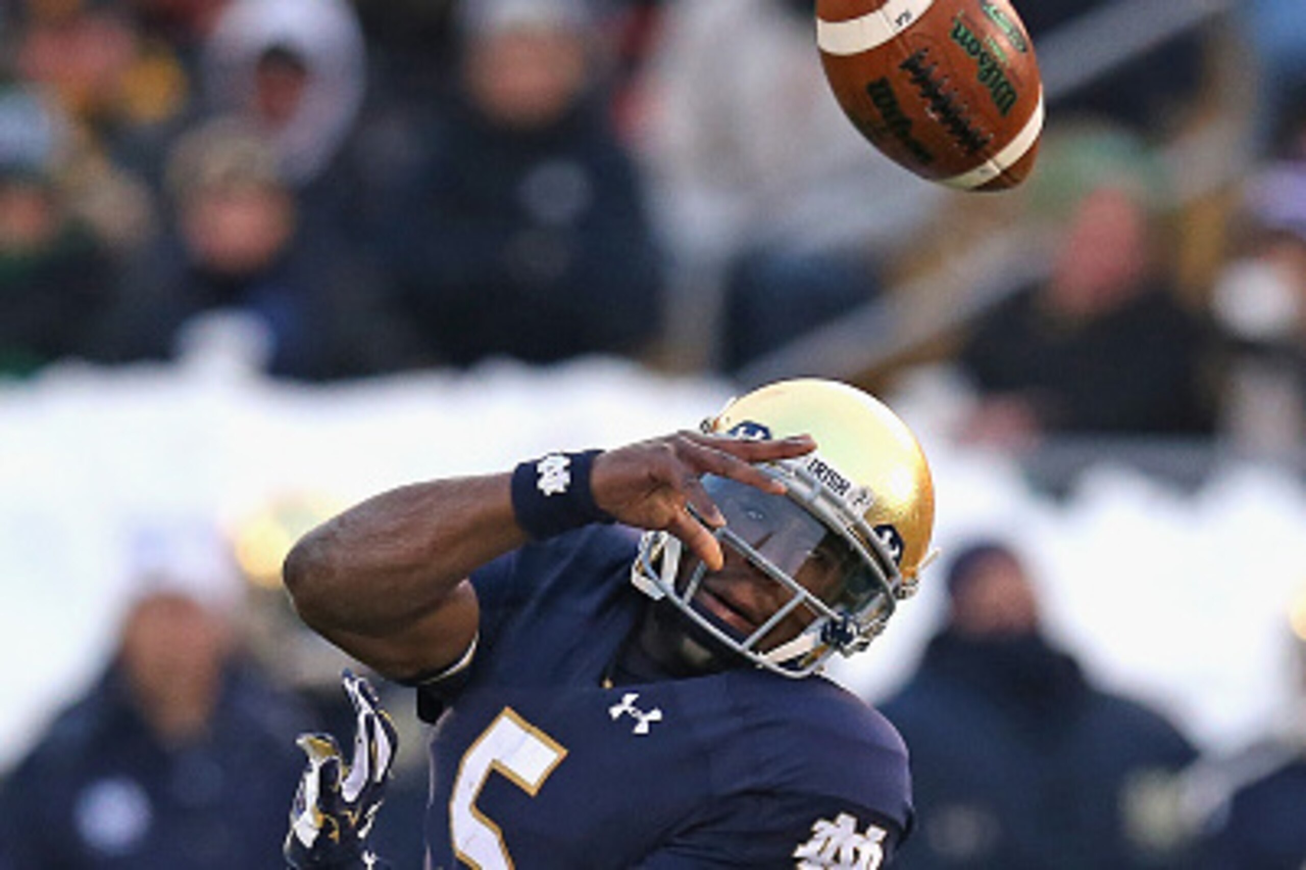 SOUTH BEND, IN - NOVEMBER 15:  Everett Golson #5 of the Notre Dame Fighting Irish is hit by Deonte Gibson 13 of the Northwestern Wildcats forcing a turnover at Notre Dame Stadium on November 15, 2014 in South Bend, Indiana.  (Photo by Jonathan Daniel/Gett
