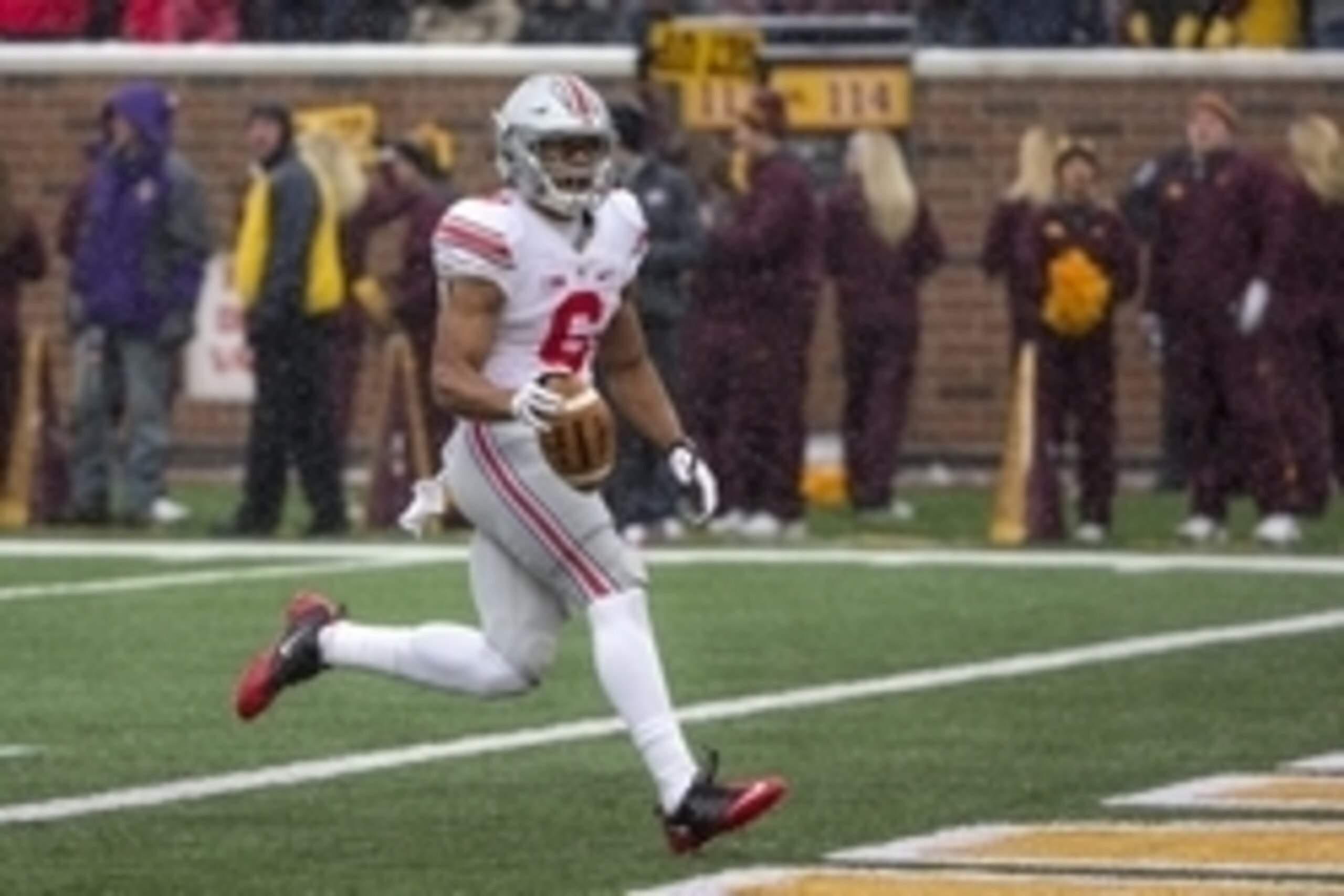 Nov 15, 2014; Minneapolis, MN, USA; Ohio State Buckeyes wide receiver Evan Spencer (6) rushes for a touchdown after making a catch in the second half against the Minnesota Golden Gophers at TCF Bank Stadium. The Buckeyes won 31-24. Mandatory Credit: Jesse Nov 15, 2014; Minneapolis, MN, USA; Ohio State Buckeyes wide receiver Evan Spencer (6) rushes for a touchdown after making a catch in the second half against the Minnesota Golden Gophers at TCF Bank Stadium. The Buckeyes won 31-24. Mandatory Credit: Jesse