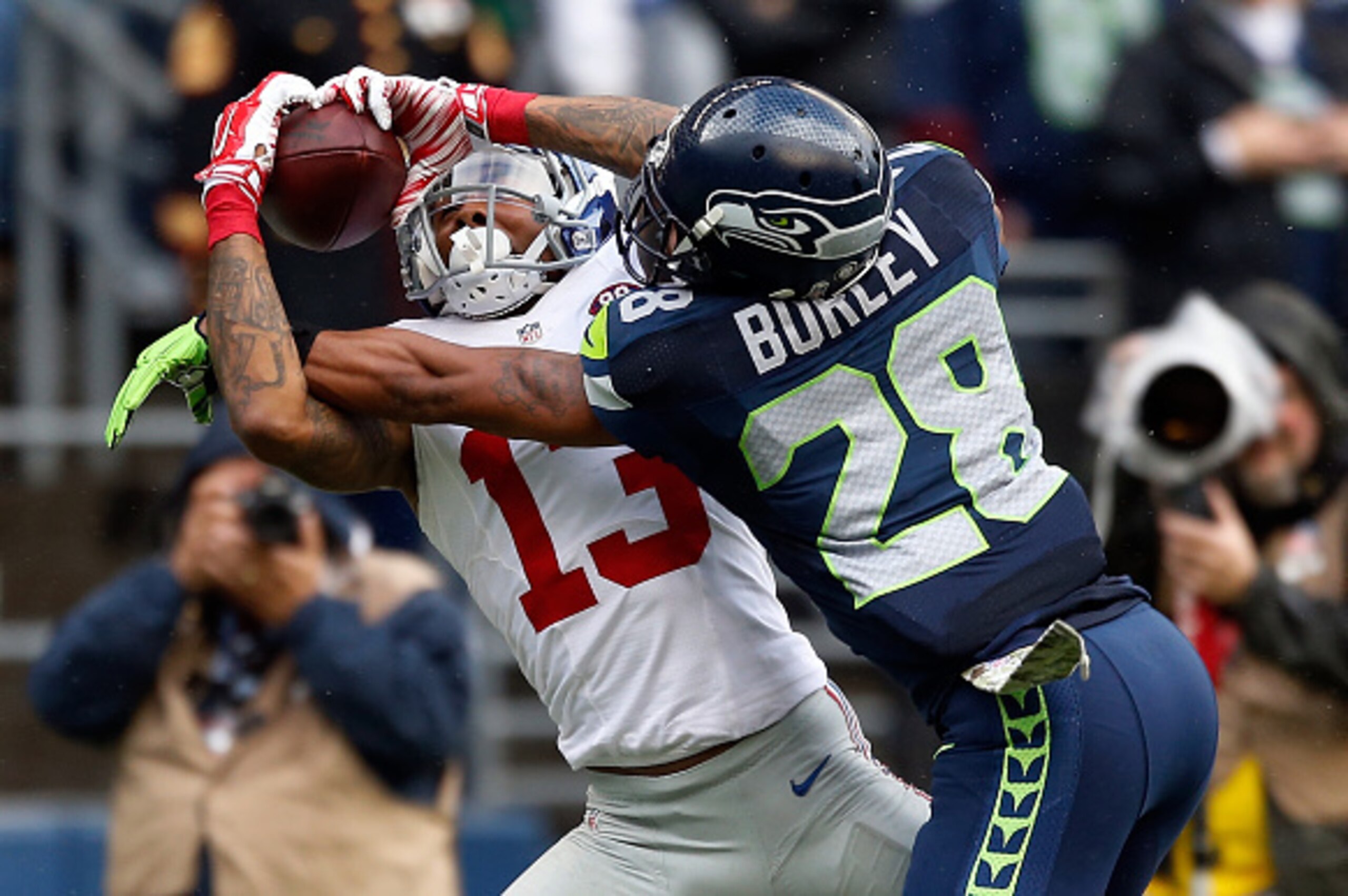 SEATTLE, WA - NOVEMBER 09: Wide receiver Odell Beckham Jr. #13 of the New York Giants catches a pass on defensive back Marcus Burley #28 of the Seattle Seahawks during the second quarter of the game at CenturyLink Field on November 9, 2014 in Seattle, Was SEATTLE, WA - NOVEMBER 09: Wide receiver Odell Beckham Jr. #13 of the New York Giants catches a pass on defensive back Marcus Burley #28 of the Seattle Seahawks during the second quarter of the game at CenturyLink Field on November 9, 2014 in Seattle, Was