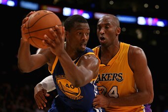 LOS ANGELES, CA - OCTOBER 09:  Harrison Barnes #40 of the Golden State Warriors is defended by Kobe Bryant #24 of the Los Angeles Lakers in the second half at Staples Center on October 9, 2014 in Los Angeles, California. The Warriors defeated the Lakers 1