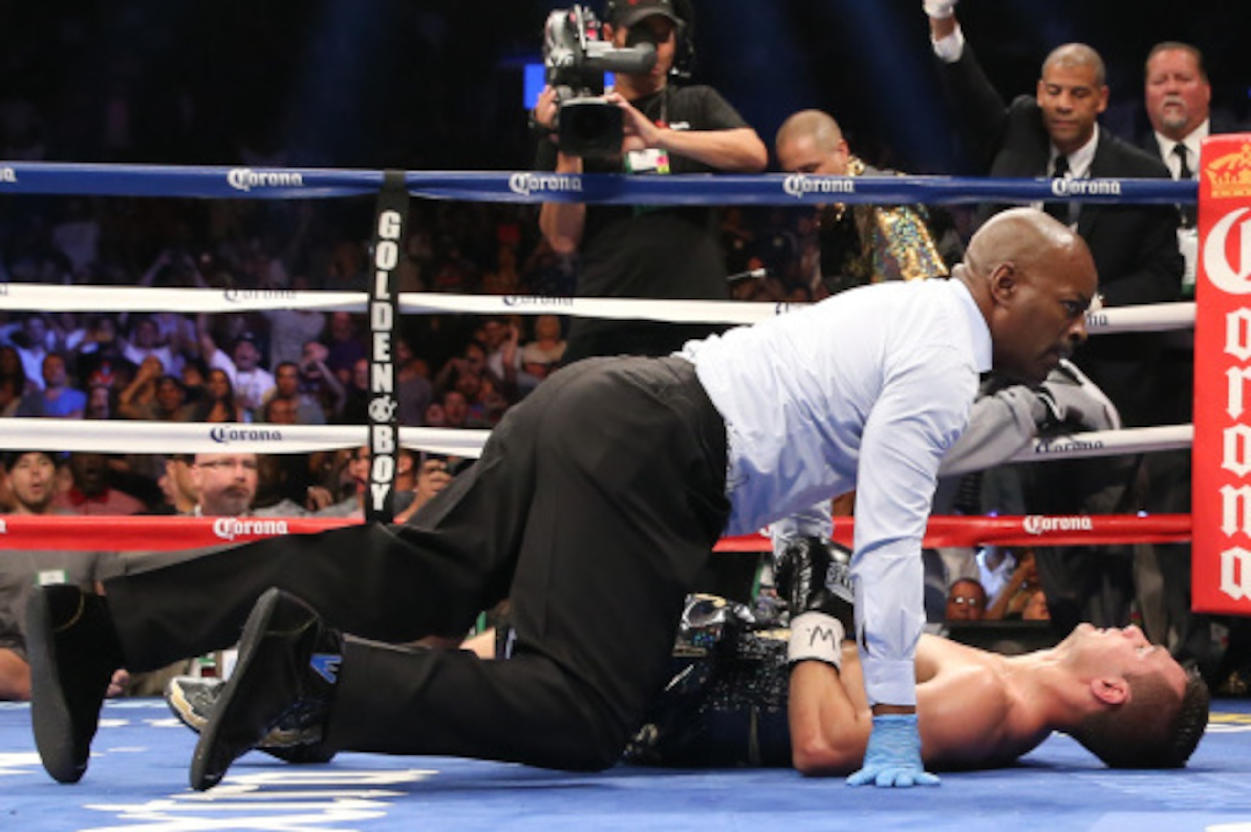 BROOKLYN, NY - AUGUST 9: Referee Steve Willis stops the bout between Danny Garcia (not shown) and Rod Salka (Black/Gold trunks) at the Barclays Center on August 9, 2014 in Brooklyn, New York. (Photo by Ed Mulholland/Getty Images)