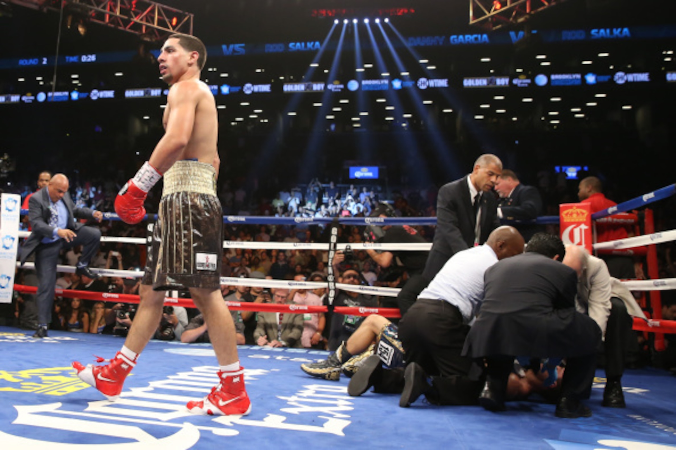 BROOKLYN, NY - AUGUST 9: Danny Garcia (Brown/Gold trunks) celebrates his KO win over Rod Salka (Black/Gold trunks) during their fight at the Barclays Center on August 9, 2014 in Brooklyn, New York. (Photo by Ed Mulholland/Getty Images)