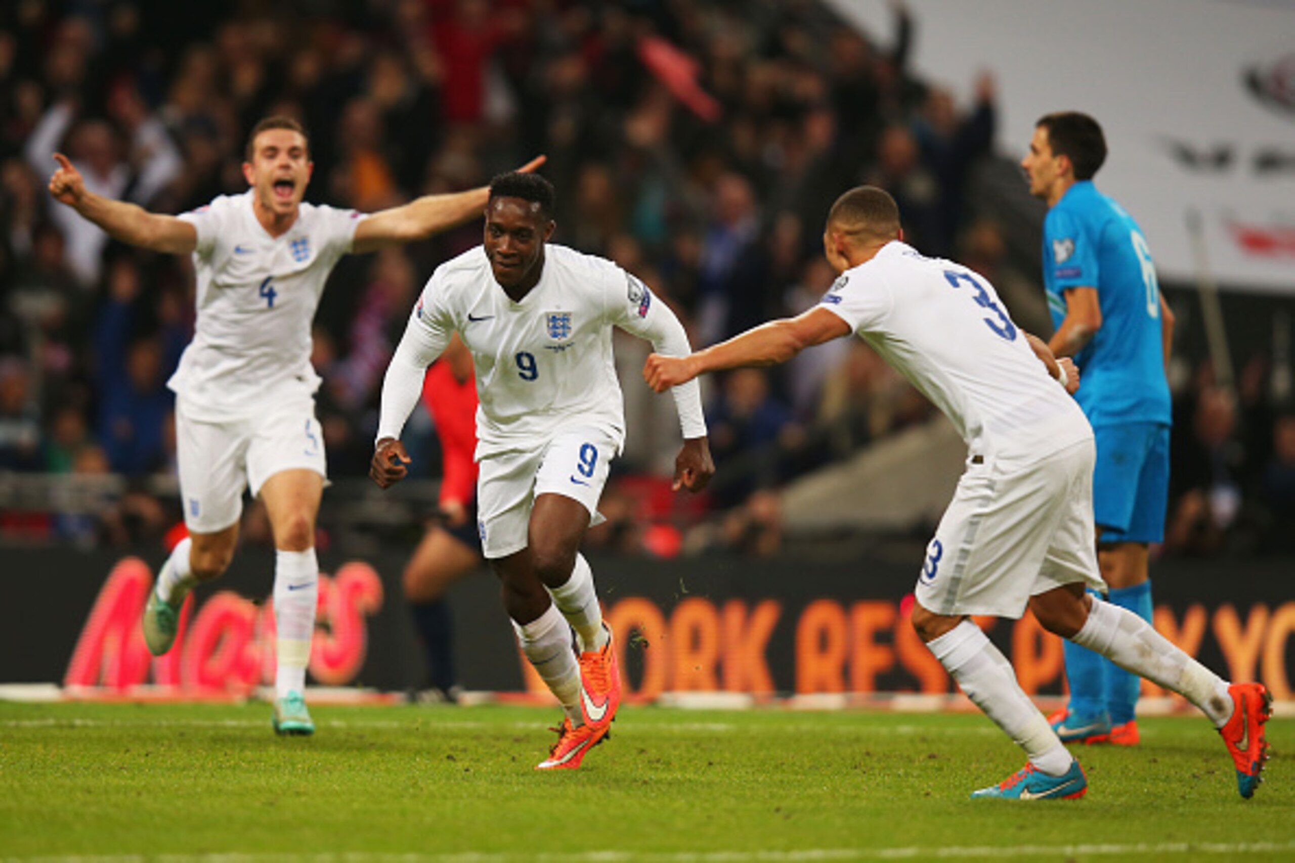 LONDON, ENGLAND - NOVEMBER 15:  Danny Welbeck of England (9) celebrates with team mates as he scores their second goal during the EURO 2016 Qualifier Group E match between England and Slovenia at Wembley Stadium on November 15, 2014 in London, England.  (