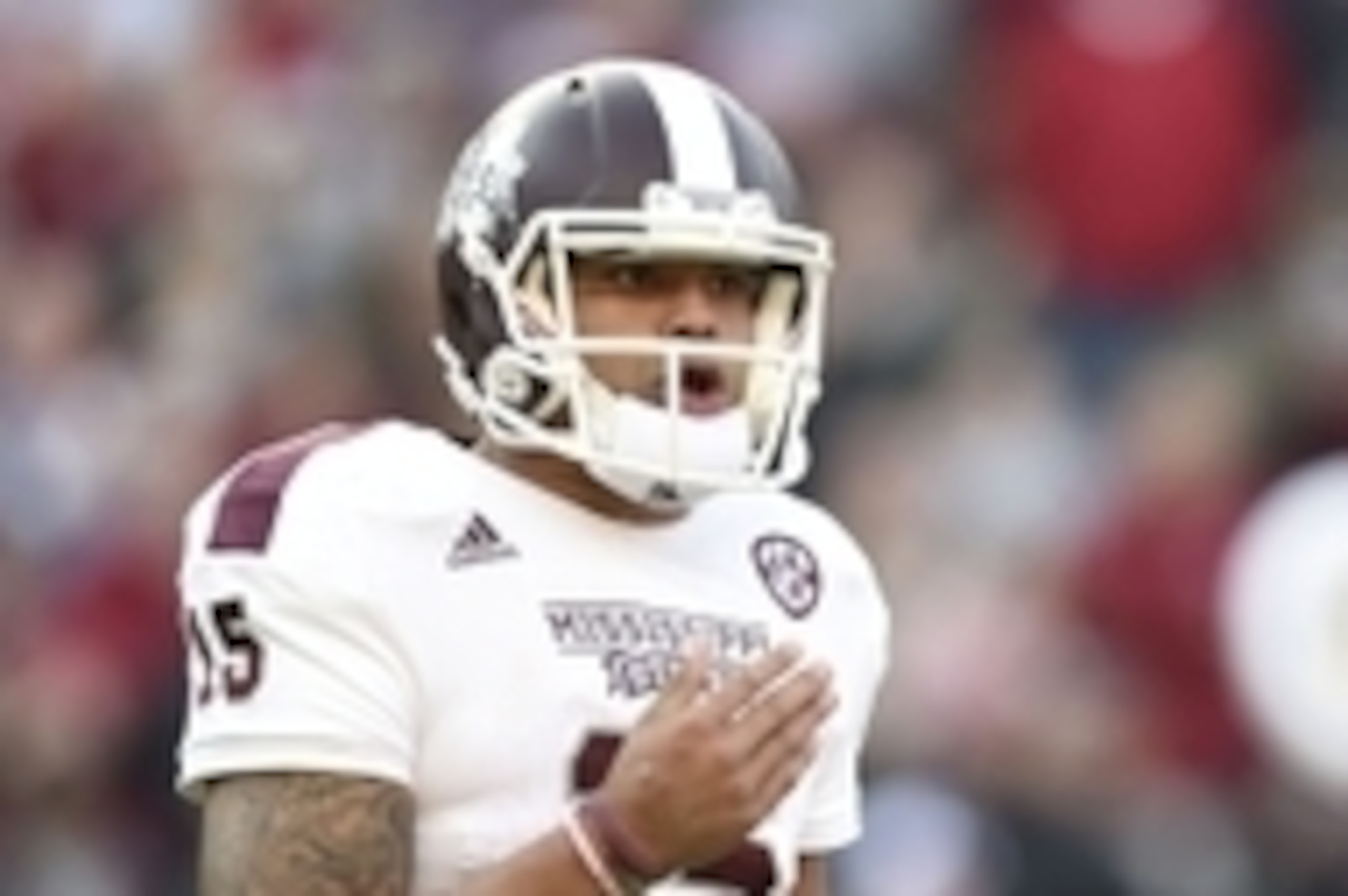 Nov 15, 2014; Tuscaloosa, AL, USA; Mississippi State Bulldogs quarterback Dak Prescott (15) reacts on the field in the second quarter against the Alabama Crimson Tide at Bryant-Denny Stadium. Mandatory Credit: John David Mercer-USA TODAY Sports