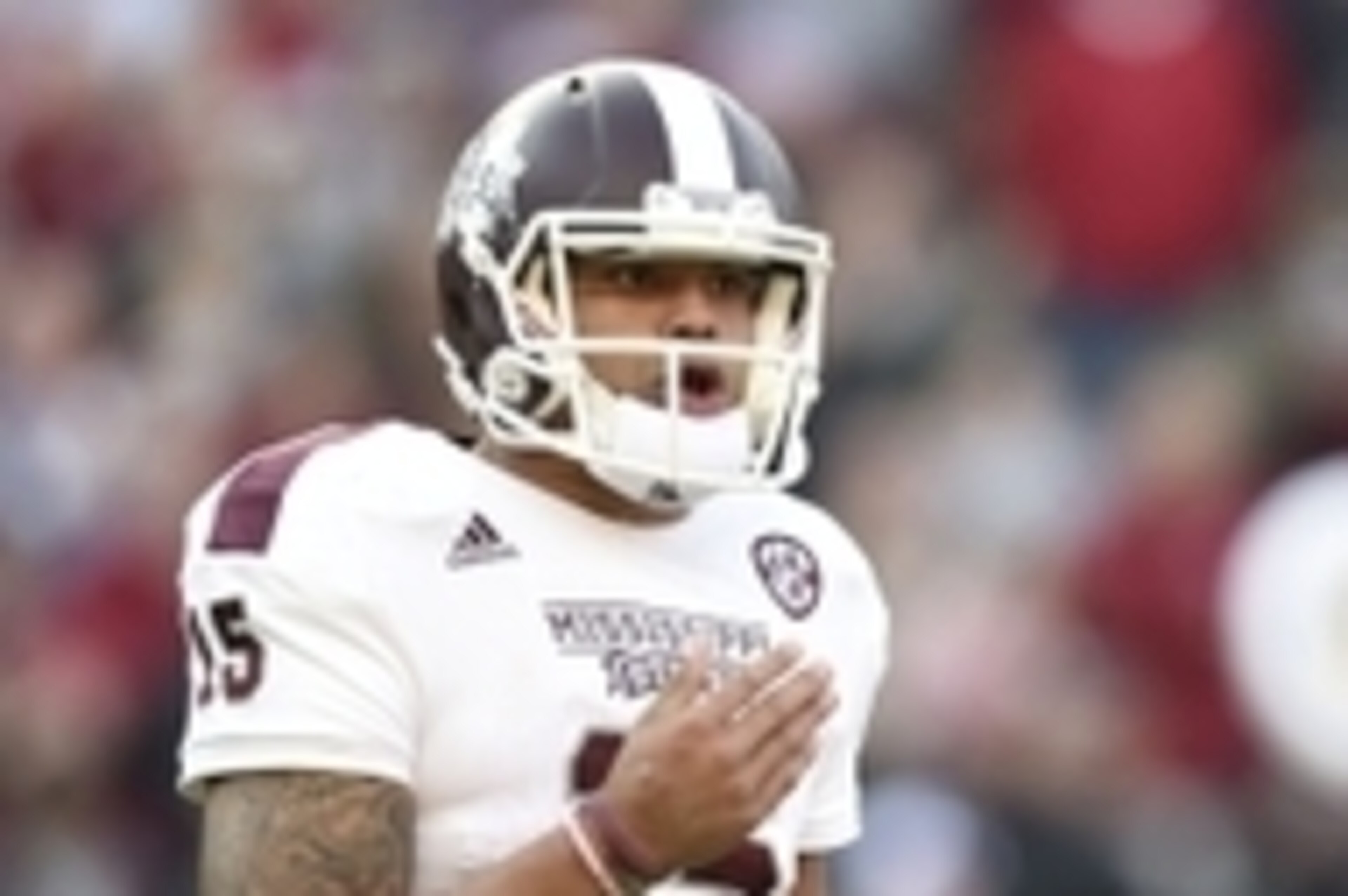 Nov 15, 2014; Tuscaloosa, AL, USA; Mississippi State Bulldogs quarterback Dak Prescott (15) reacts on the field in the second quarter against the Alabama Crimson Tide at Bryant-Denny Stadium. Mandatory Credit: John David Mercer-USA TODAY Sports