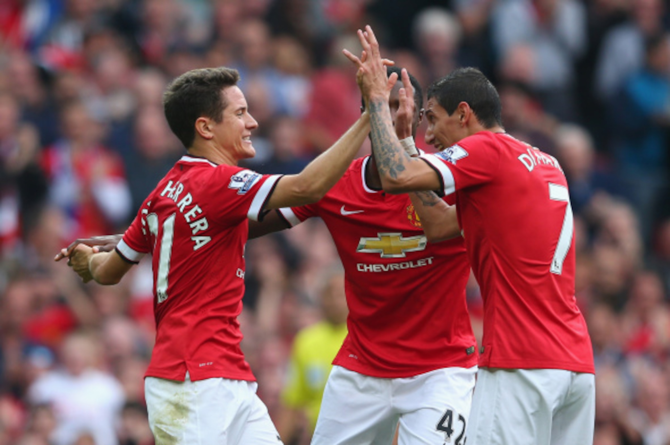 MANCHESTER, ENGLAND - SEPTEMBER 14:   Ander Herrera of Manchester United (L) celebrates scoring the second goal with team-mate Angel Di Maria (R) during the Barclays Premier League match between Manchester United and Queens Park Rangers at Old Trafford on