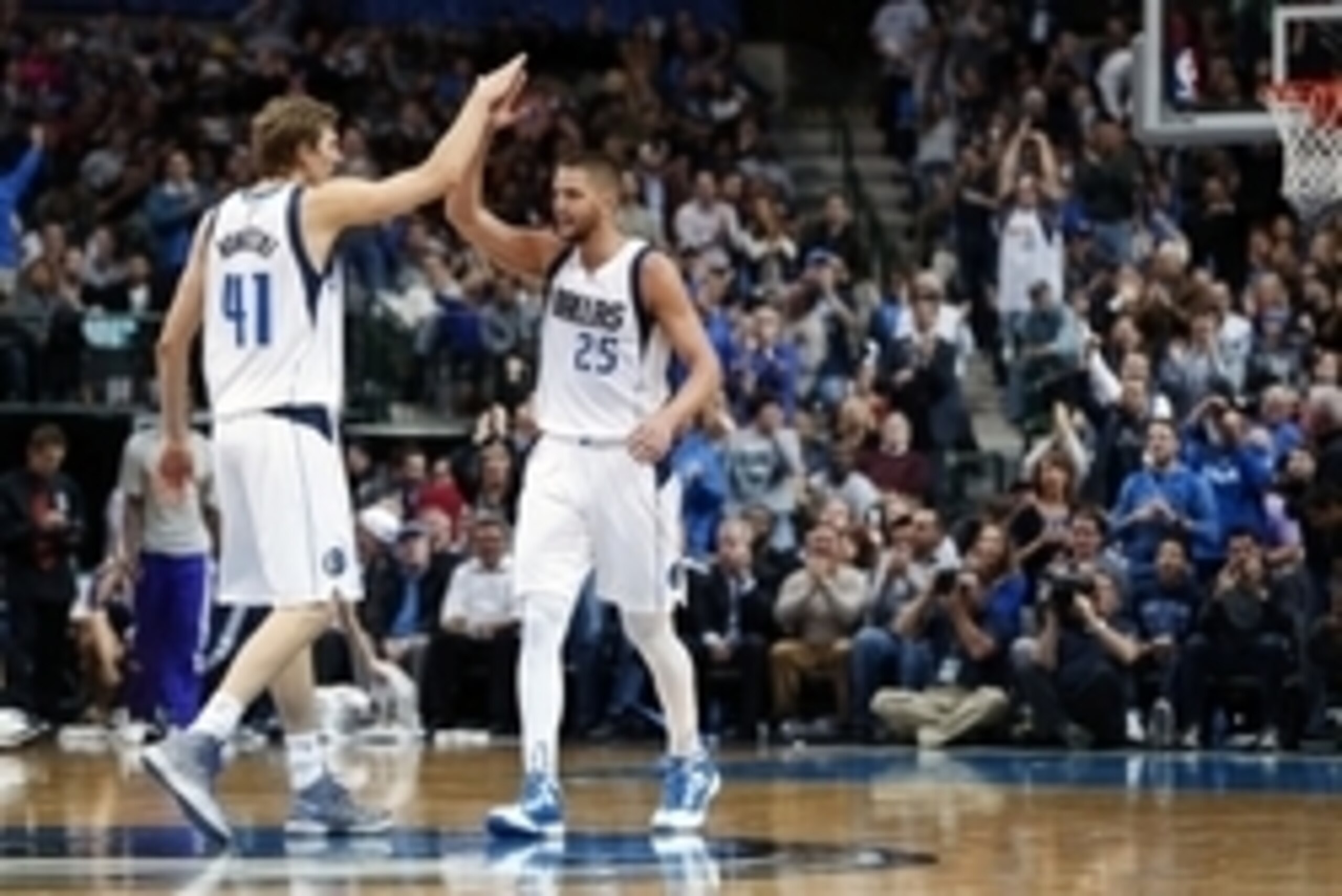 Nov 11, 2014; Dallas, TX, USA; Dallas Mavericks forward Chandler Parsons (25) celebrates with forward Dirk Nowitzki (41) after scoring during the first half against the Sacramento Kings at American Airlines Center. Mandatory Credit: Kevin Jairaj-USA TODAY