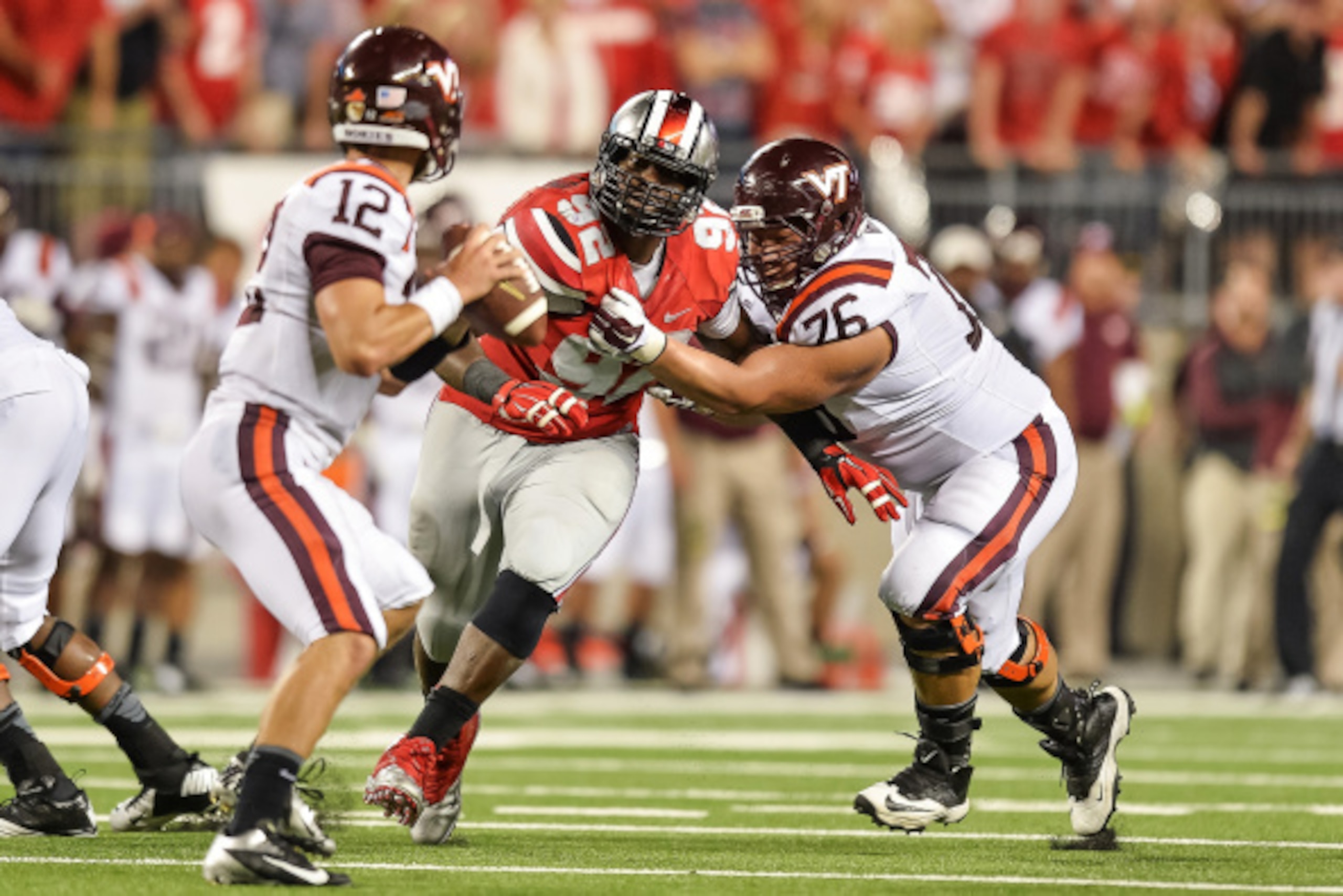 COLUMBUS, OH - SEPTEMBER 6:  Adolphus Washington #92 of the Ohio State Buckeyes pressures the quarterback against the Virginia Tech Hokies at Ohio Stadium on September 6, 2014 in Columbus, Ohio.  (Photo by Jamie Sabau/Getty Images)