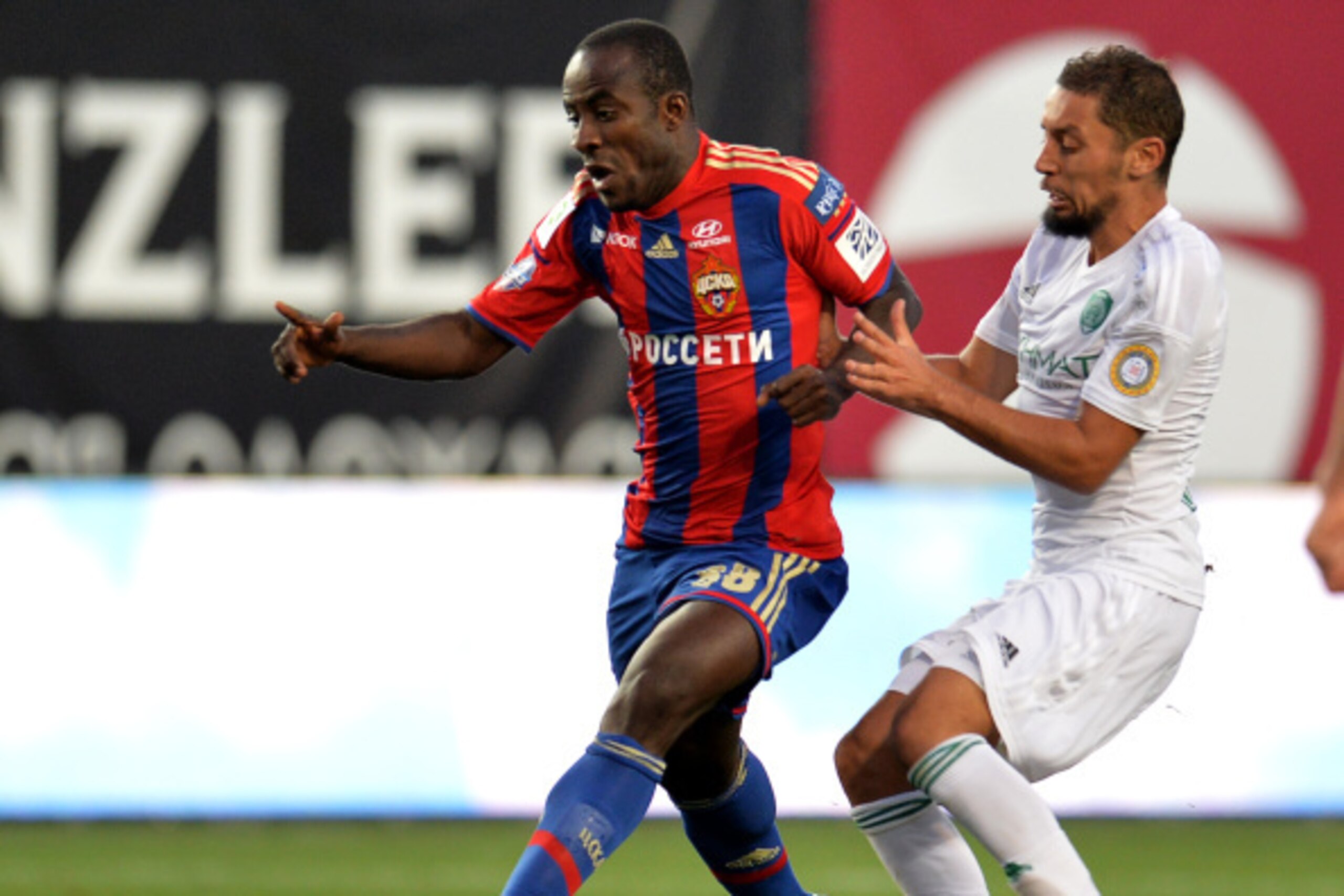 KHIMKI, RUSSIA - AUGUST 13: Seydou Doumbia (L) of PFC CSKA Moscow challenged by Ismail Aissati of FC Terek Grozny during the Russian Premier League match between PFC CSKA Moscow and FC Terek Grozny at the Arena Khimki Stadium on August 13, 2014 in Khimki, KHIMKI, RUSSIA - AUGUST 13: Seydou Doumbia (L) of PFC CSKA Moscow challenged by Ismail Aissati of FC Terek Grozny during the Russian Premier League match between PFC CSKA Moscow and FC Terek Grozny at the Arena Khimki Stadium on August 13, 2014 in Khimki,