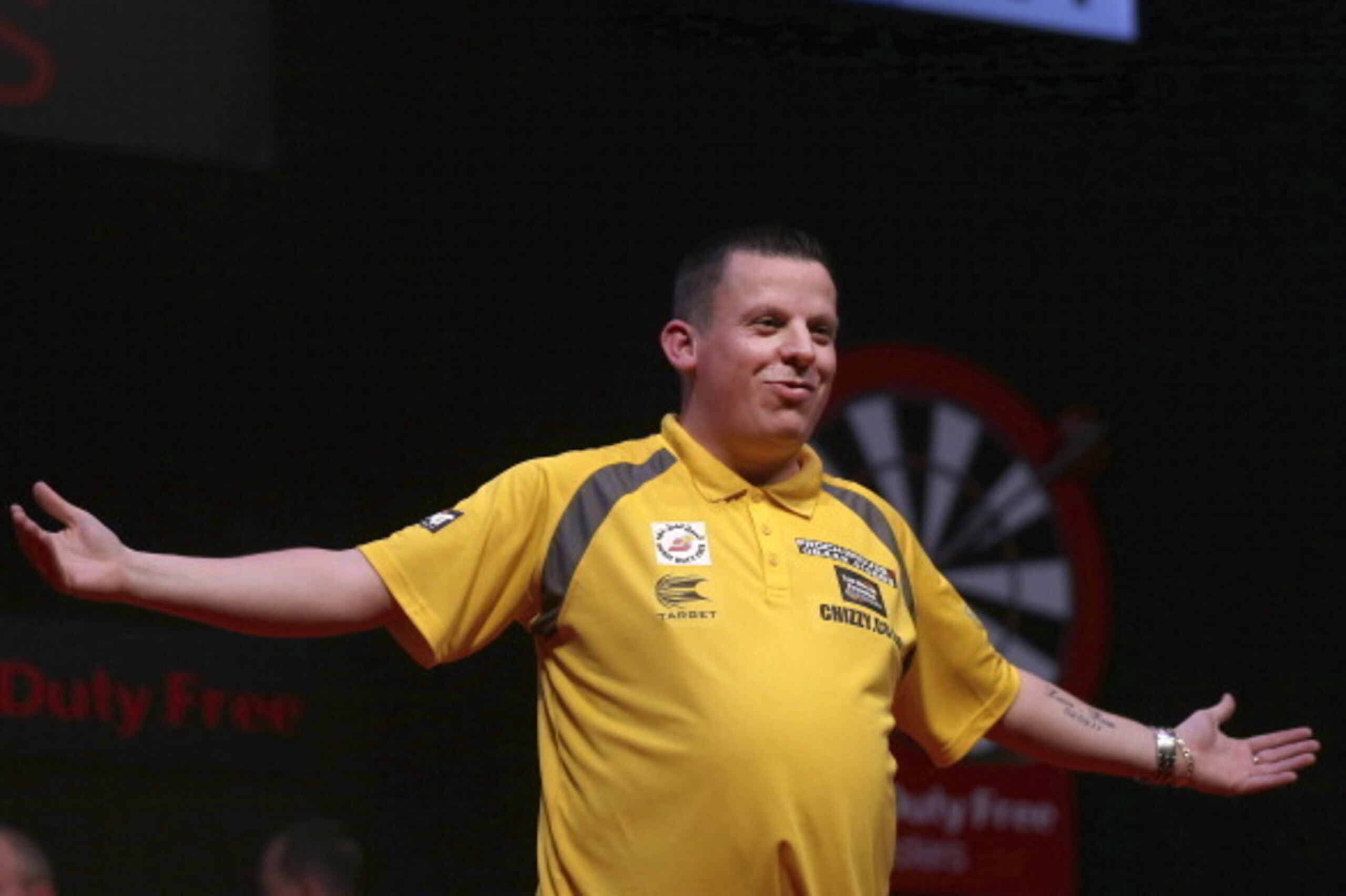 DUBAI, UNITED ARAB EMIRATES - MAY 29: Dave Chisnall of England celebrates after defeating Simon Whitlock of Australia during the 2014 Dubai Duty Free Darts Masters Quarter-Final match at Dubai Duty Free Tennis Stadium, Irish Village on May 29, 2014 in Du DUBAI, UNITED ARAB EMIRATES - MAY 29: Dave Chisnall of England celebrates after defeating Simon Whitlock of Australia during the 2014 Dubai Duty Free Darts Masters Quarter-Final match at Dubai Duty Free Tennis Stadium, Irish Village on May 29, 2014 in Du