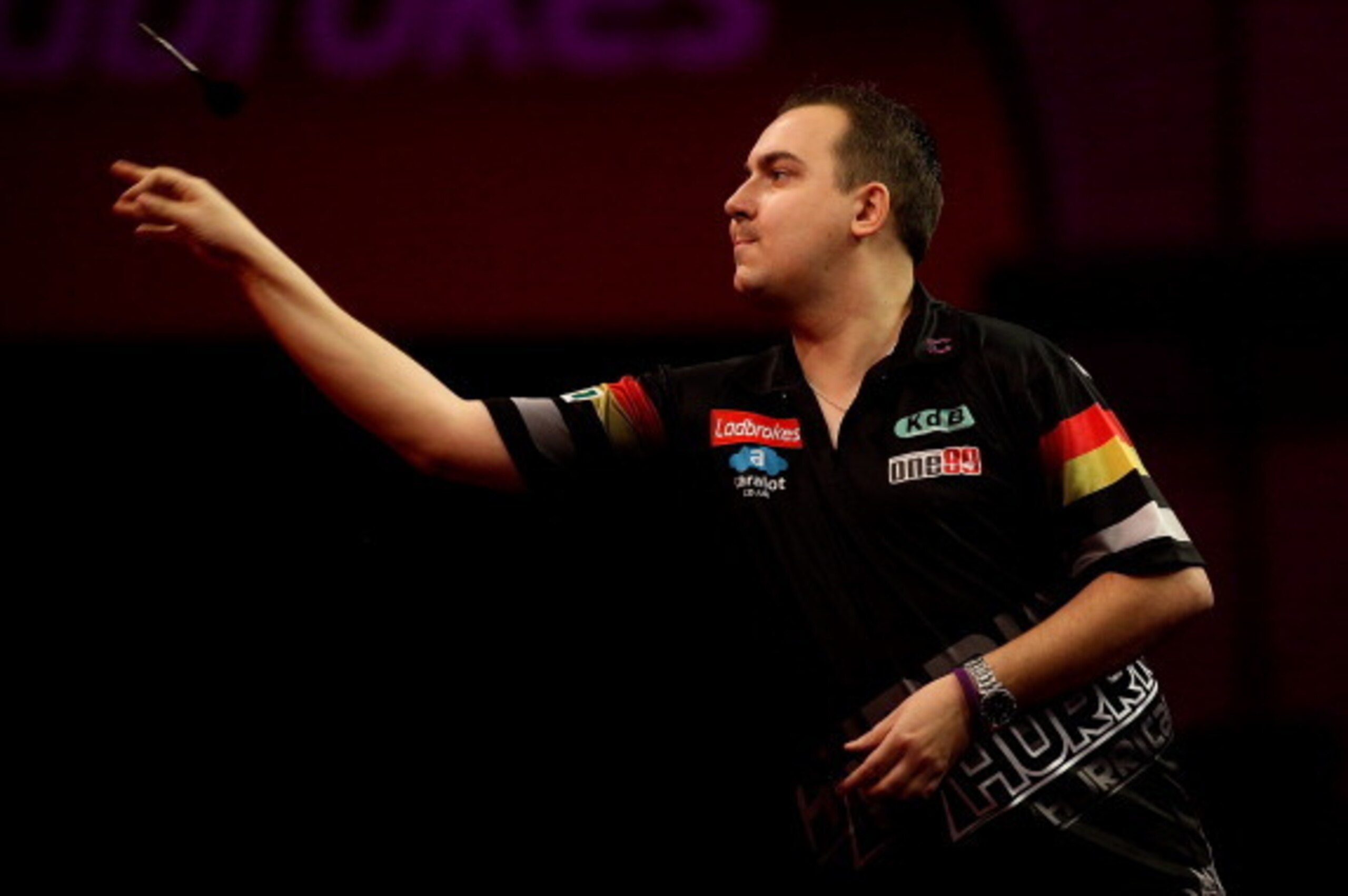 LONDON, ENGLAND - DECEMBER 16: Kim Huybrechts of Belgium in action during his first round match against Ronny Huybrechts on day four of the 2014 Ladbrokes.com World Darts Championships at Alexandra Palace on December 16, 2013 in London, England. (Photo b LONDON, ENGLAND - DECEMBER 16: Kim Huybrechts of Belgium in action during his first round match against Ronny Huybrechts on day four of the 2014 Ladbrokes.com World Darts Championships at Alexandra Palace on December 16, 2013 in London, England. (Photo b