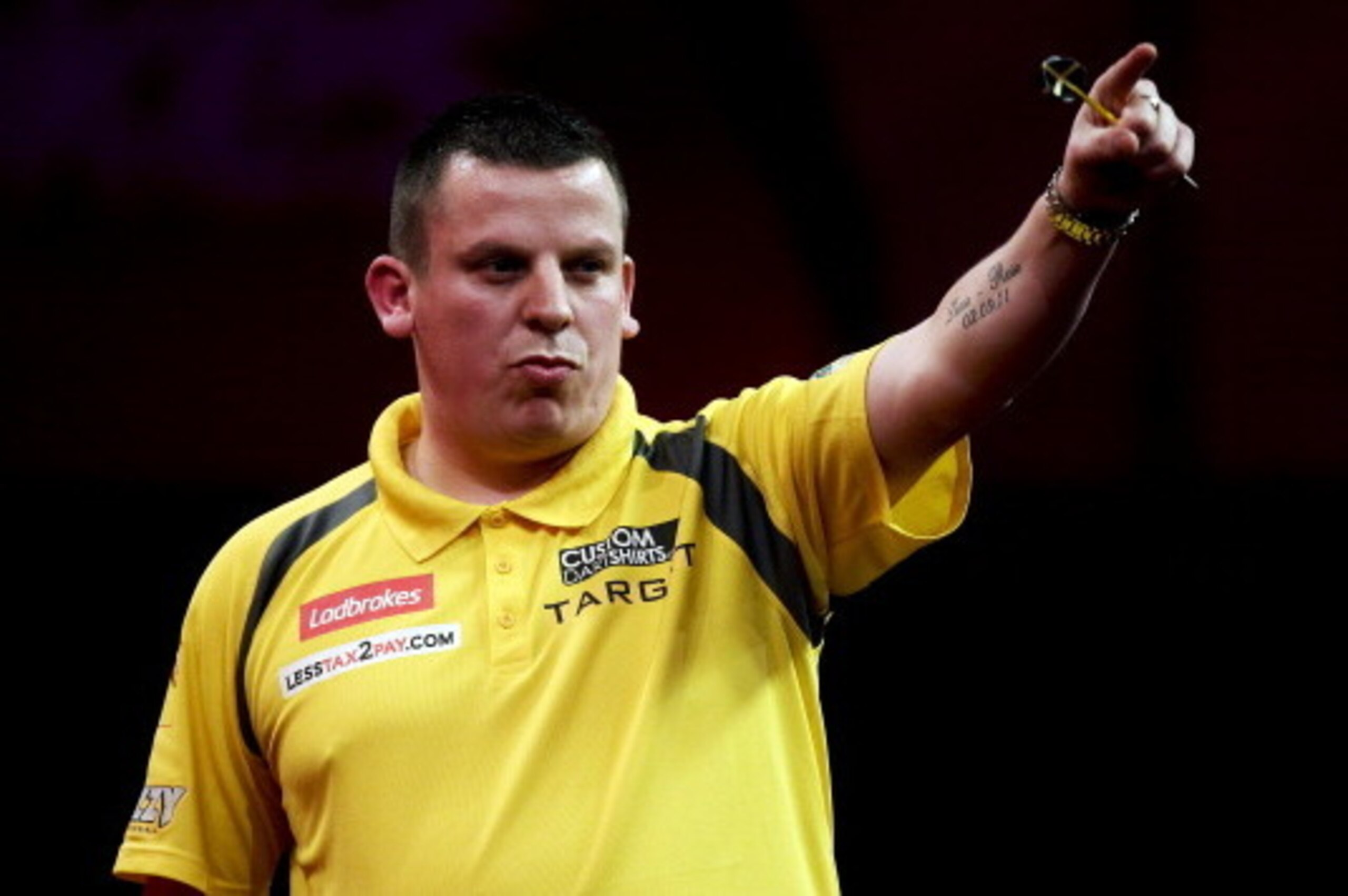 LONDON, ENGLAND - DECEMBER 21: Dave Chisnall of England celebrates during his second round match on day eight of the 2013 Ladbrokes.com World Darts Championship at the Alexandra Palace on December 21, 2012 in London, England. (Photo by Ben Hoskins/Getty I LONDON, ENGLAND - DECEMBER 21: Dave Chisnall of England celebrates during his second round match on day eight of the 2013 Ladbrokes.com World Darts Championship at the Alexandra Palace on December 21, 2012 in London, England. (Photo by Ben Hoskins/Getty I