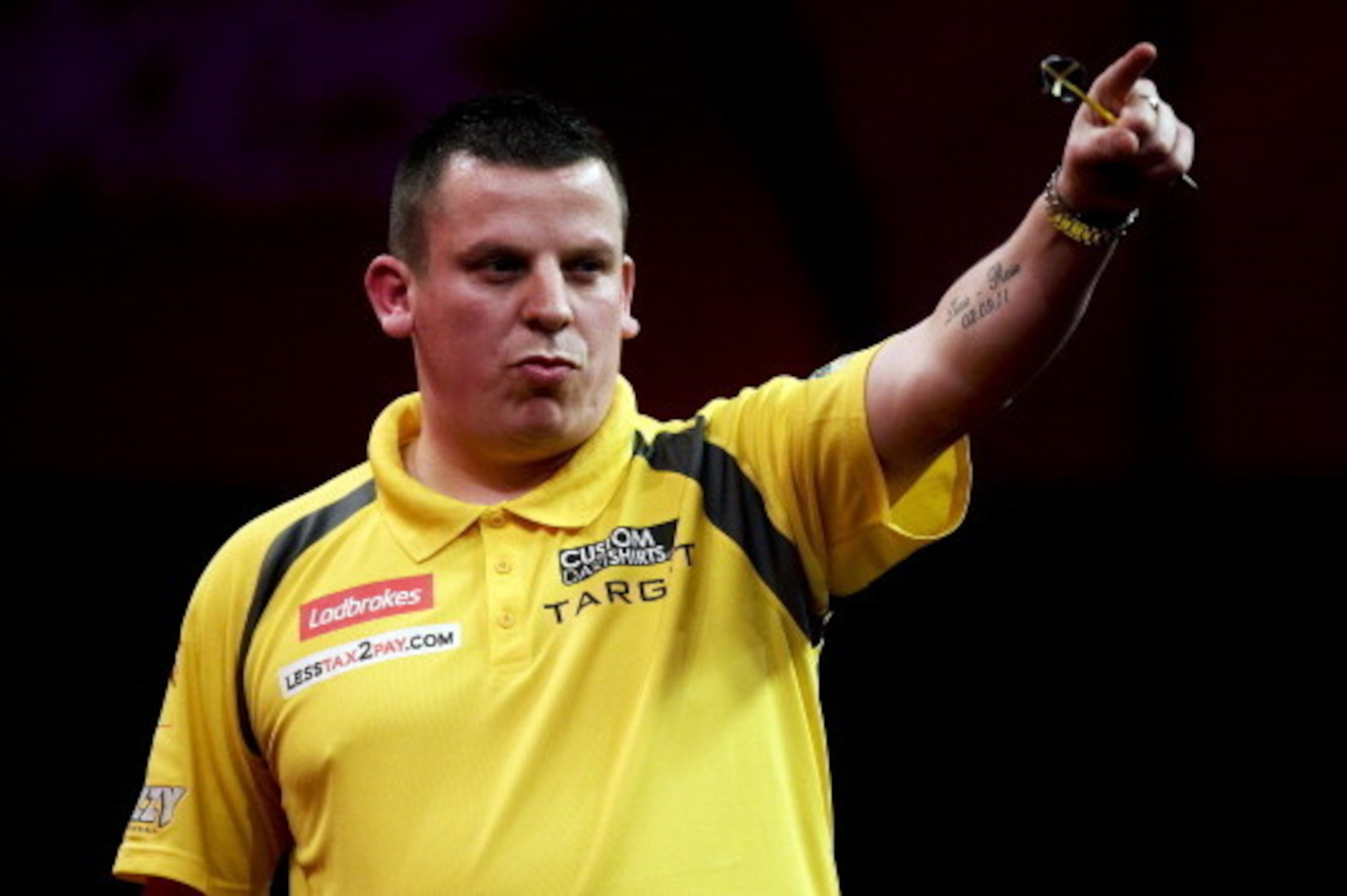 LONDON, ENGLAND - DECEMBER 21: Dave Chisnall of England celebrates during his second round match on day eight of the 2013 Ladbrokes.com World Darts Championship at the Alexandra Palace on December 21, 2012 in London, England. (Photo by Ben Hoskins/Getty I