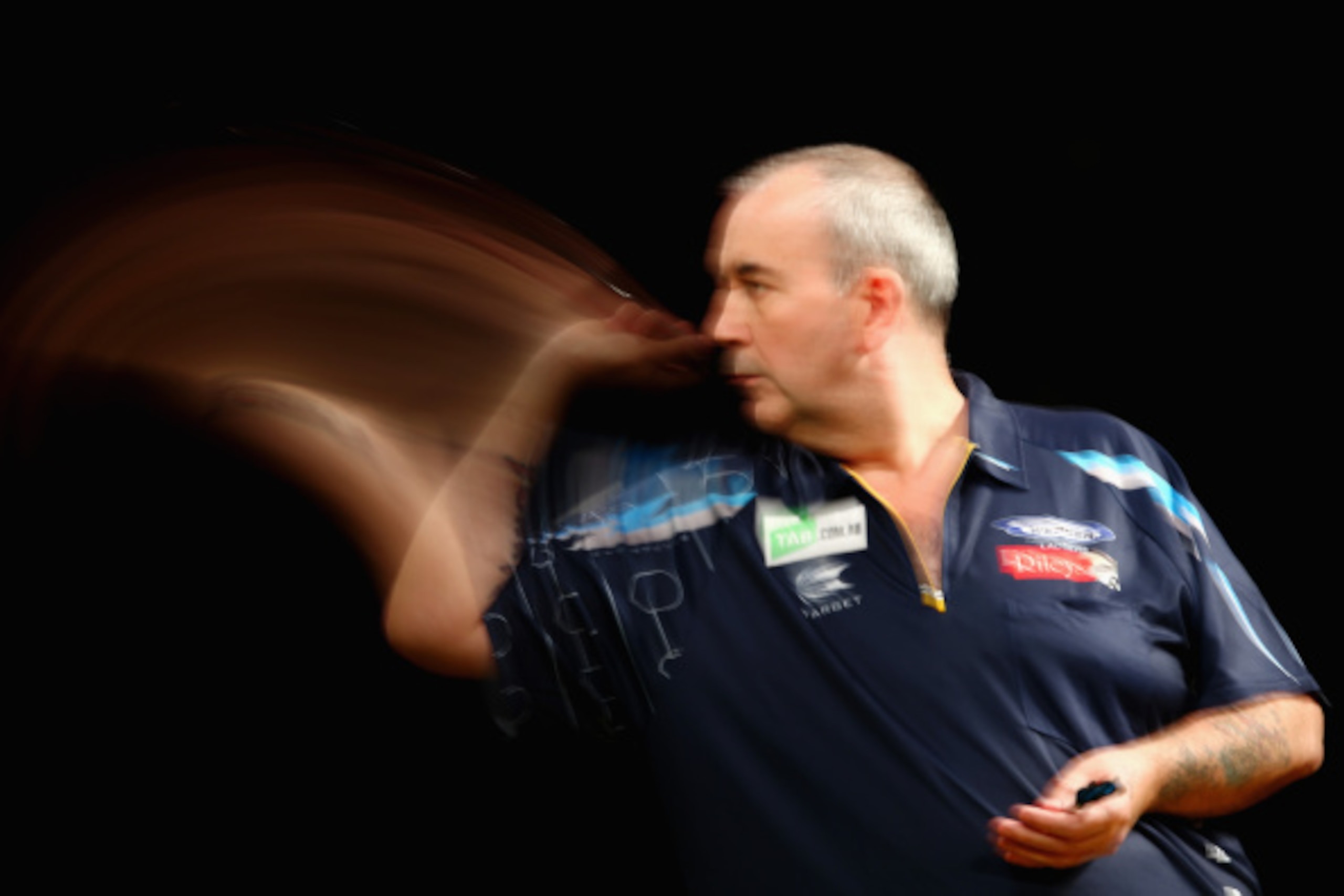 SYDNEY, AUSTRALIA - AUGUST 29: Phil Taylor of England competes in his quarter-final match against Dave Chisnall of England during the Sydney Darts Masters at Hordern Pavilion on August 29, 2014 in Sydney, Australia. (Photo by Mark Kolbe/Getty Images) SYDNEY, AUSTRALIA - AUGUST 29: Phil Taylor of England competes in his quarter-final match against Dave Chisnall of England during the Sydney Darts Masters at Hordern Pavilion on August 29, 2014 in Sydney, Australia. (Photo by Mark Kolbe/Getty Images)