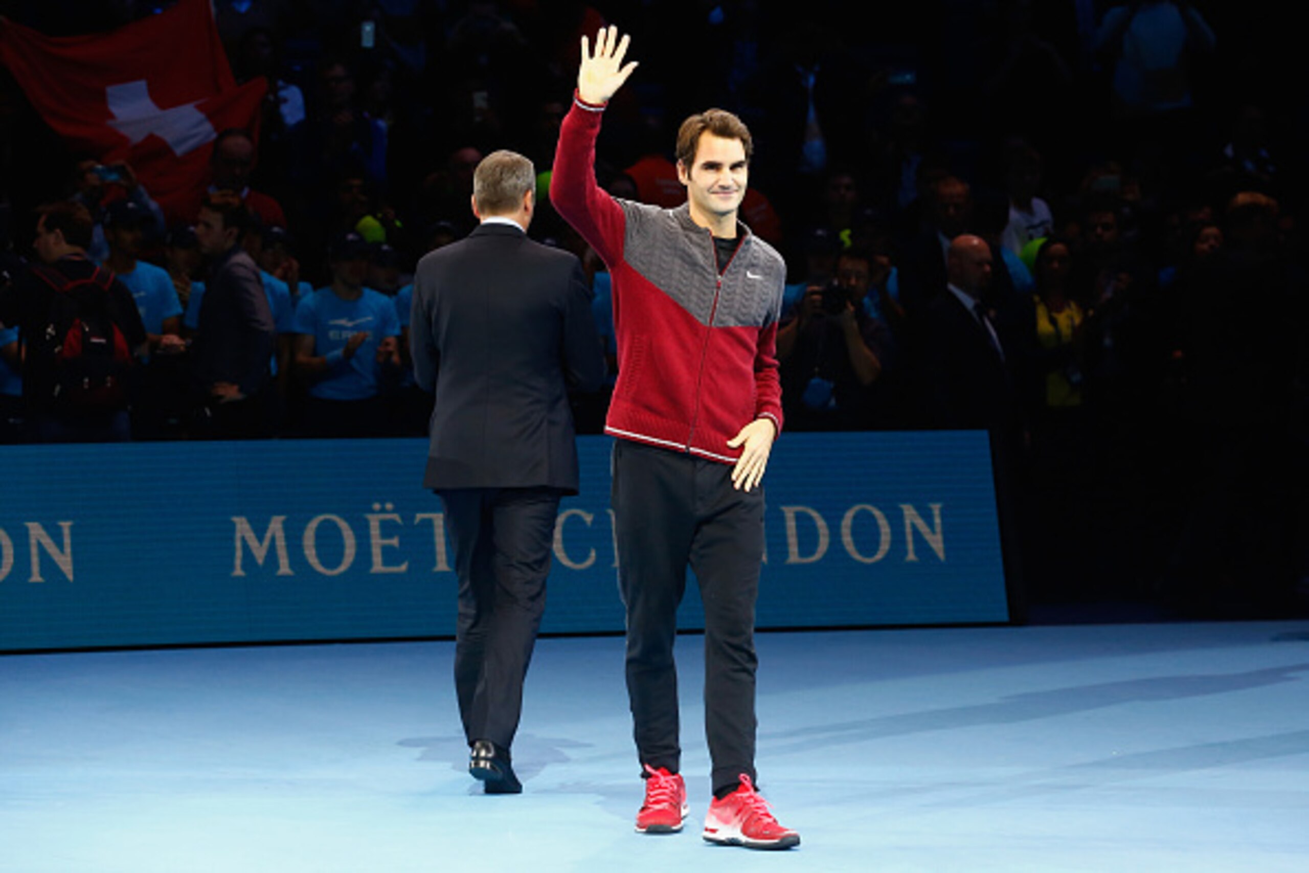 LONDON, ENGLAND - NOVEMBER 16: Roger Federer of Switzerland waves after announcing his decision to withdraw from the singles final match against Novak Djokovic of Serbia on day eight of the Barclays ATP World Tour Finals at O2 Arena on November 16, 2014 LONDON, ENGLAND - NOVEMBER 16: Roger Federer of Switzerland waves after announcing his decision to withdraw from the singles final match against Novak Djokovic of Serbia on day eight of the Barclays ATP World Tour Finals at O2 Arena on November 16, 2014