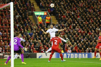 LIVERPOOL, ENGLAND - OCTOBER 22:  Karim Benzema of Real Madrid scores his team's second goal during the UEFA Champions League Group B match between Liverpool and Real Madrid CF on October 22, 2014 in Liverpool, United Kingdom.  (Photo by Alex Livesey/Gett