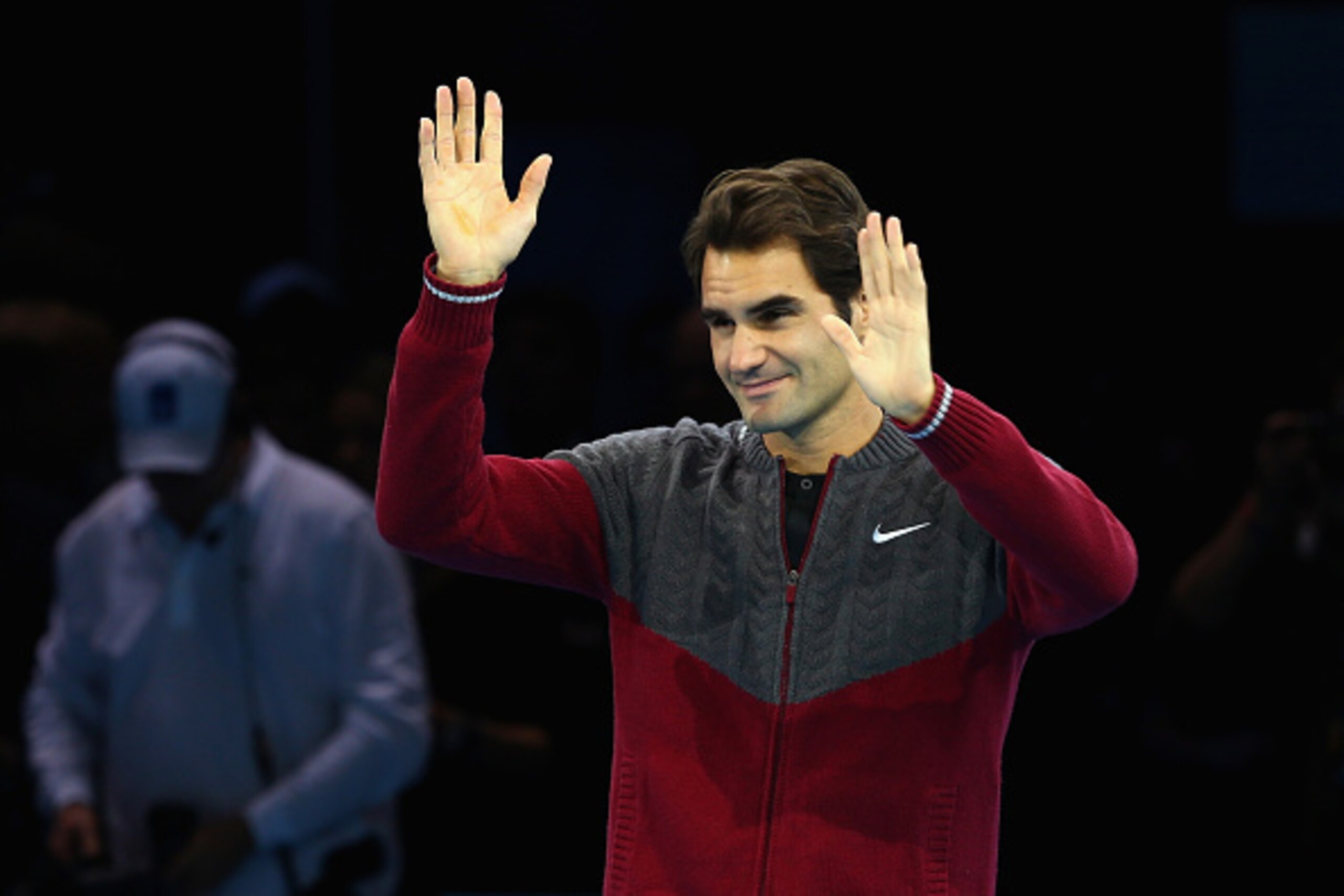 LONDON, ENGLAND - NOVEMBER 16:  Roger Federer of Switzerland waves after announcing his decision to withdraw from the singles final match against Novak Djokovic of Serbia on day eight of the Barclays ATP World Tour Finals at O2 Arena on November 16, 2014 