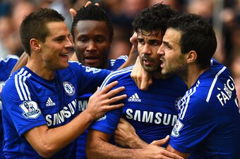 LONDON, ENGLAND - OCTOBER 05:  Diego Costa of Chelsea celebrates scoring their second goal with Cesar Azpilicueta and Cesc Fabregas of Chelsea during the Barclays Premier League match between Chelsea and Arsenal at Stamford Bridge on October 4, 2014 in Lo