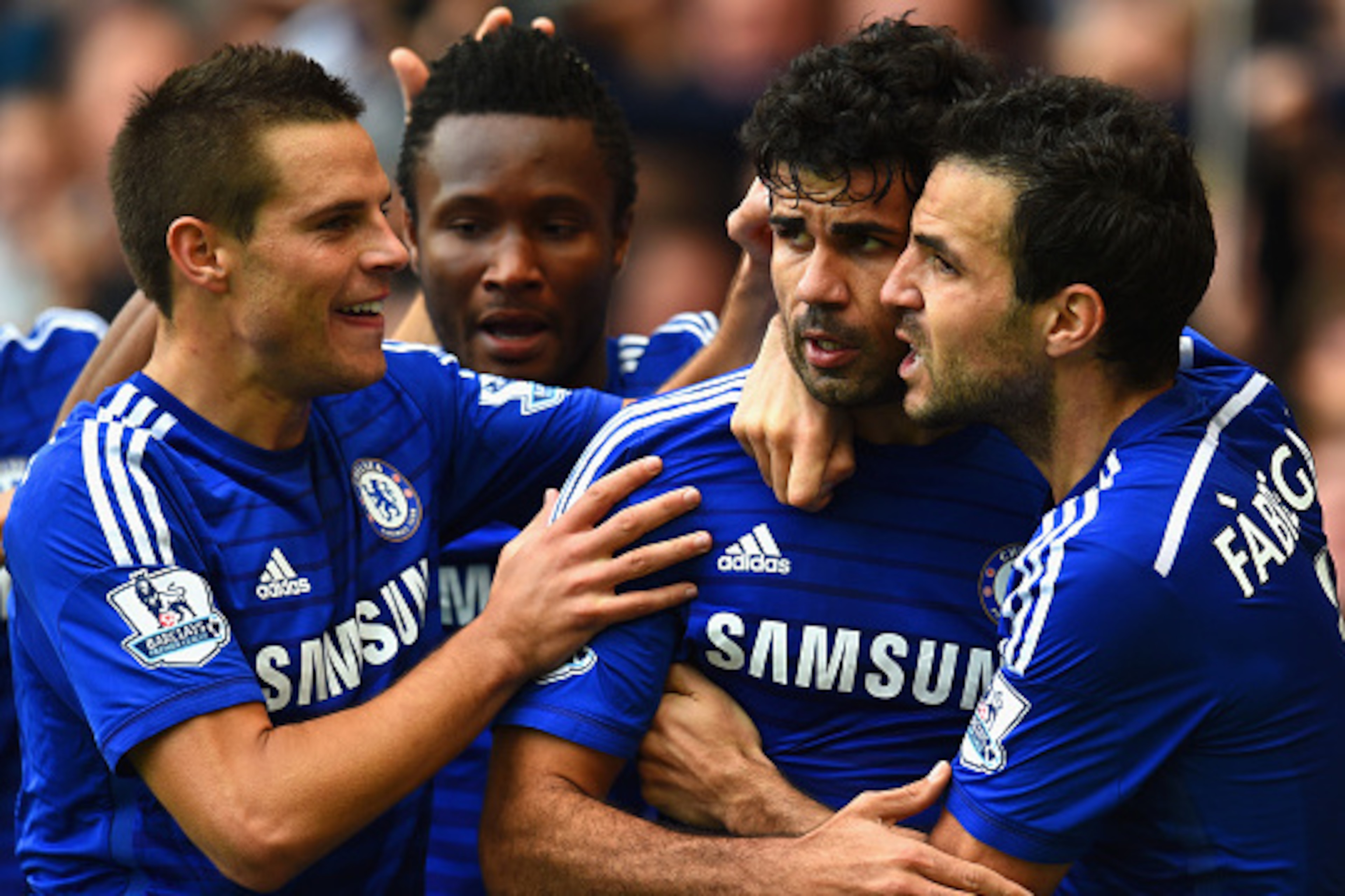 LONDON, ENGLAND - OCTOBER 05:  Diego Costa of Chelsea celebrates scoring their second goal with Cesar Azpilicueta and Cesc Fabregas of Chelsea during the Barclays Premier League match between Chelsea and Arsenal at Stamford Bridge on October 4, 2014 in Lo