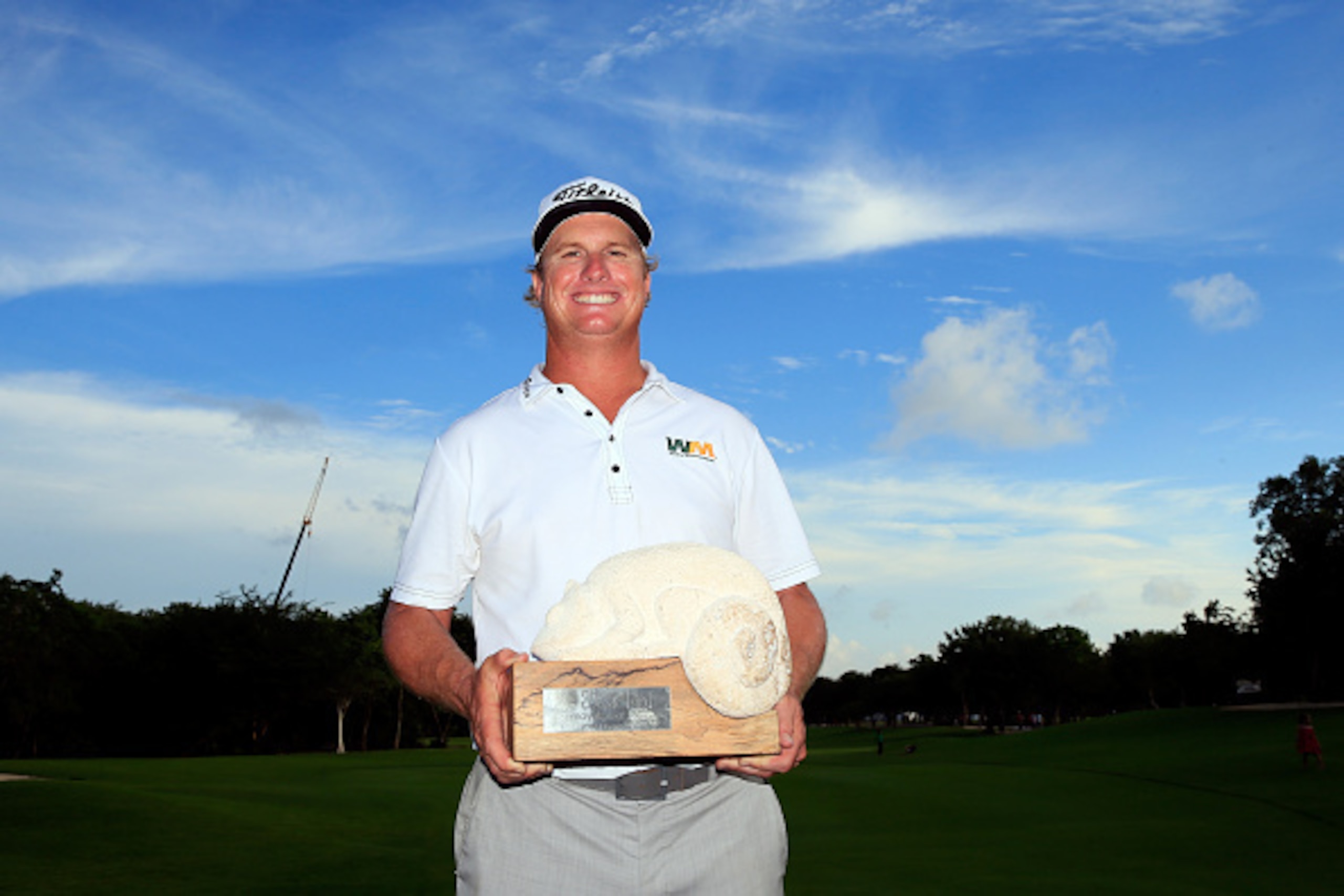 PLAYA DEL CARMEN, MEXICO - NOVEMBER 16:  Charley Hoffman of the United States celebrates with the trophy after winning the final round of the OHL Classic at the Mayakoba El Camaleon Golf Club on November 16, 2014 in Playa del Carmen, Mexico.  (Photo by Ro