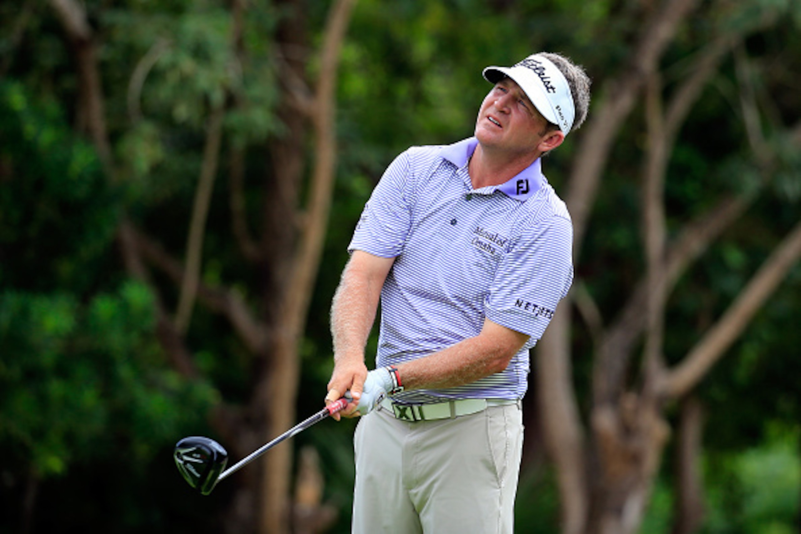 PLAYA DEL CARMEN, MEXICO - NOVEMBER 16:  Jason Bohn of the United States hits a tee shot on the 7th hole during the final round of the OHL Classic at the Mayakoba El Camaleon Golf Club on November 16, 2014 in Playa del Carmen, Mexico.  (Photo by Rob Carr/