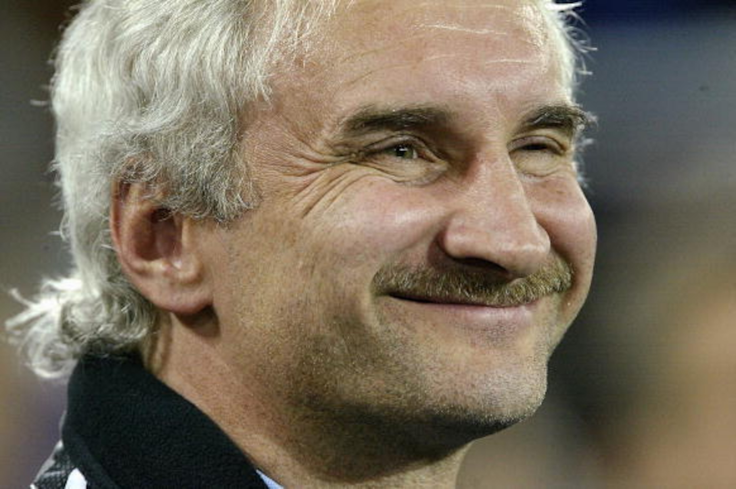 COLOGNE, GERMANY - MARCH 31:  German coach, Rudi Voller looks happy during the friendly international match between Germany and Belgium at the Rheinenergie Stadium on March 31,  2004 in Cologne, Germany.(Photo by Gary M Prior/Getty Images)