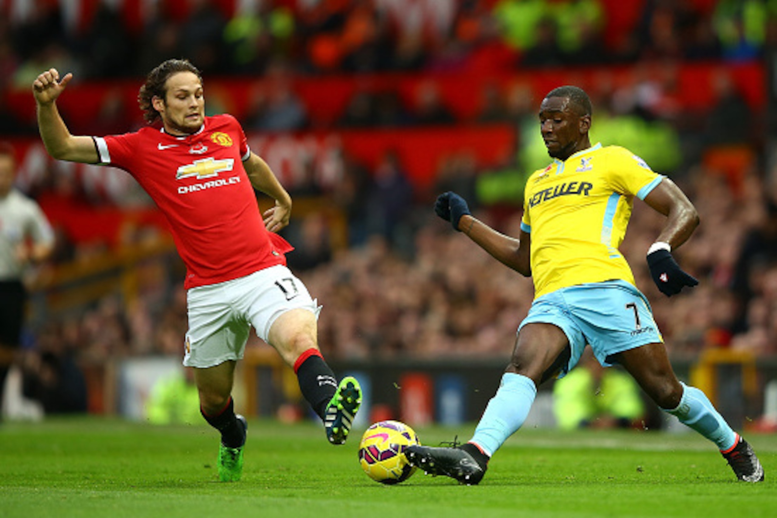 MANCHESTER, ENGLAND - NOVEMBER 08:  Daley Blind of Manchester United competes with Yannick Bolasie of Crystal Palace during the Barclays Premier League match between Manchester United and Crystal Palace at Old Trafford on November 8, 2014 in Manchester, E