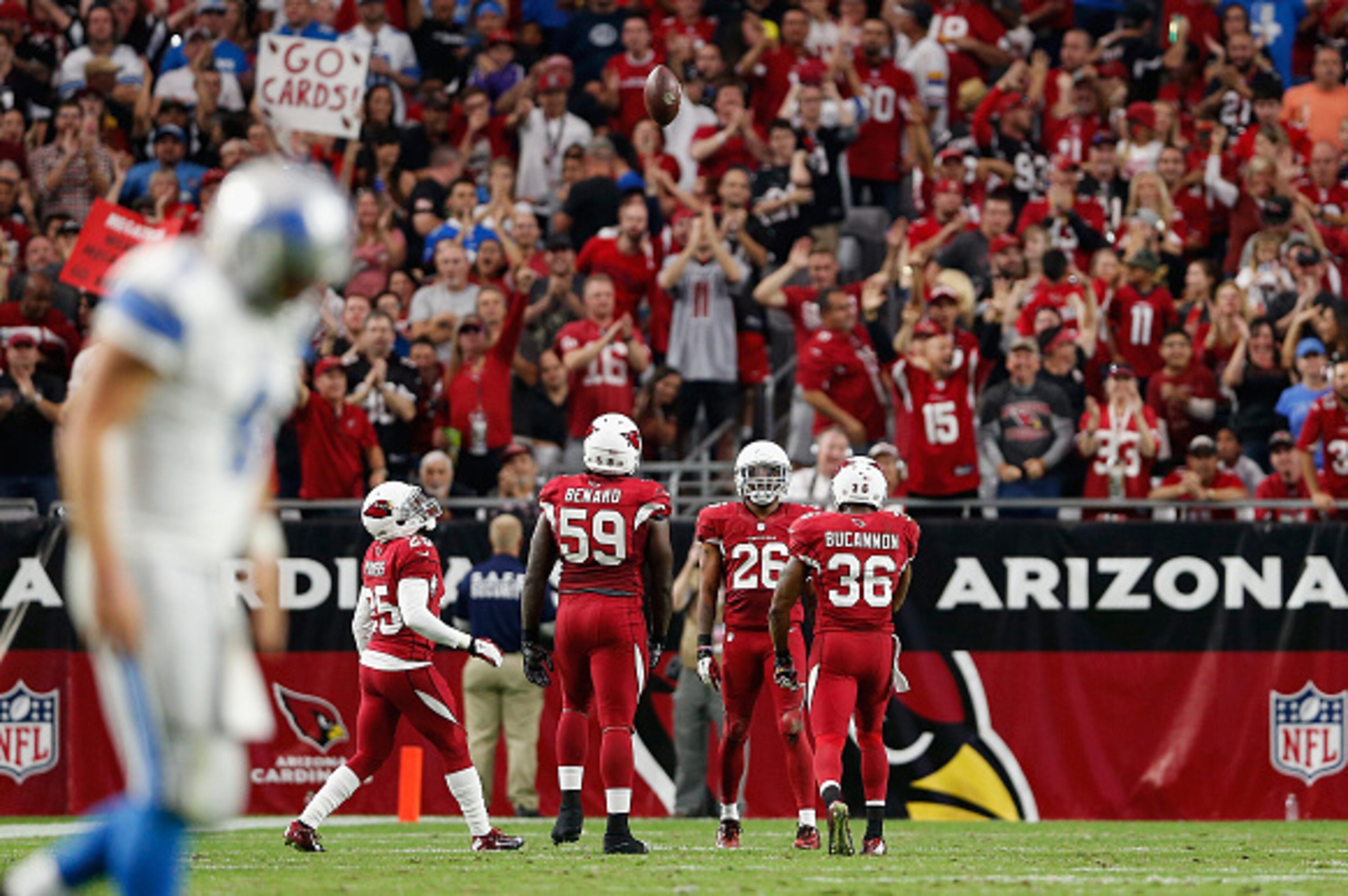 GLENDALE, AZ - NOVEMBER 16:  Free safety Rashad Johnson #26 of the Arizona Cardinals celebrates with teammates after an inception in the third quarter during the NFL game against the Detroit Lions at the University of Phoenix Stadium on November 16, 2014 