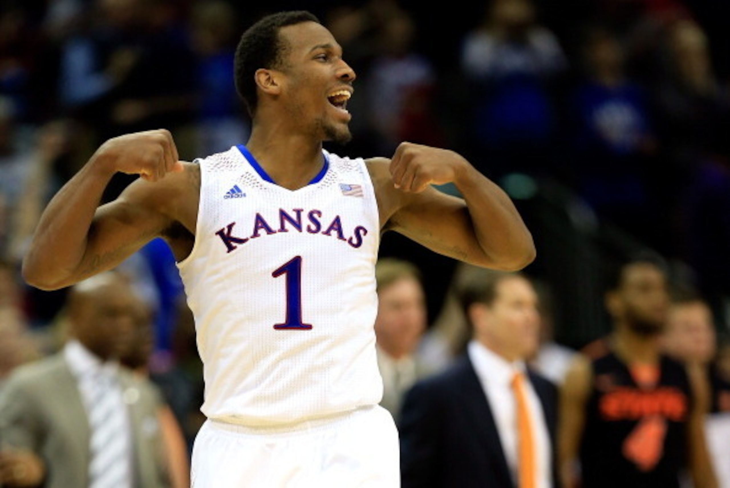 KANSAS CITY, MO - MARCH 13:  Wayne Selden, Jr. #1 of the Kansas Jayhawks celebrates as the Jayahwks defeat the Oklahoma State Cowboys 77-70 to win the Big 12 Basketball Tournament quarterfinal game at Sprint Center on March 13, 2014 in Kansas City, Missou