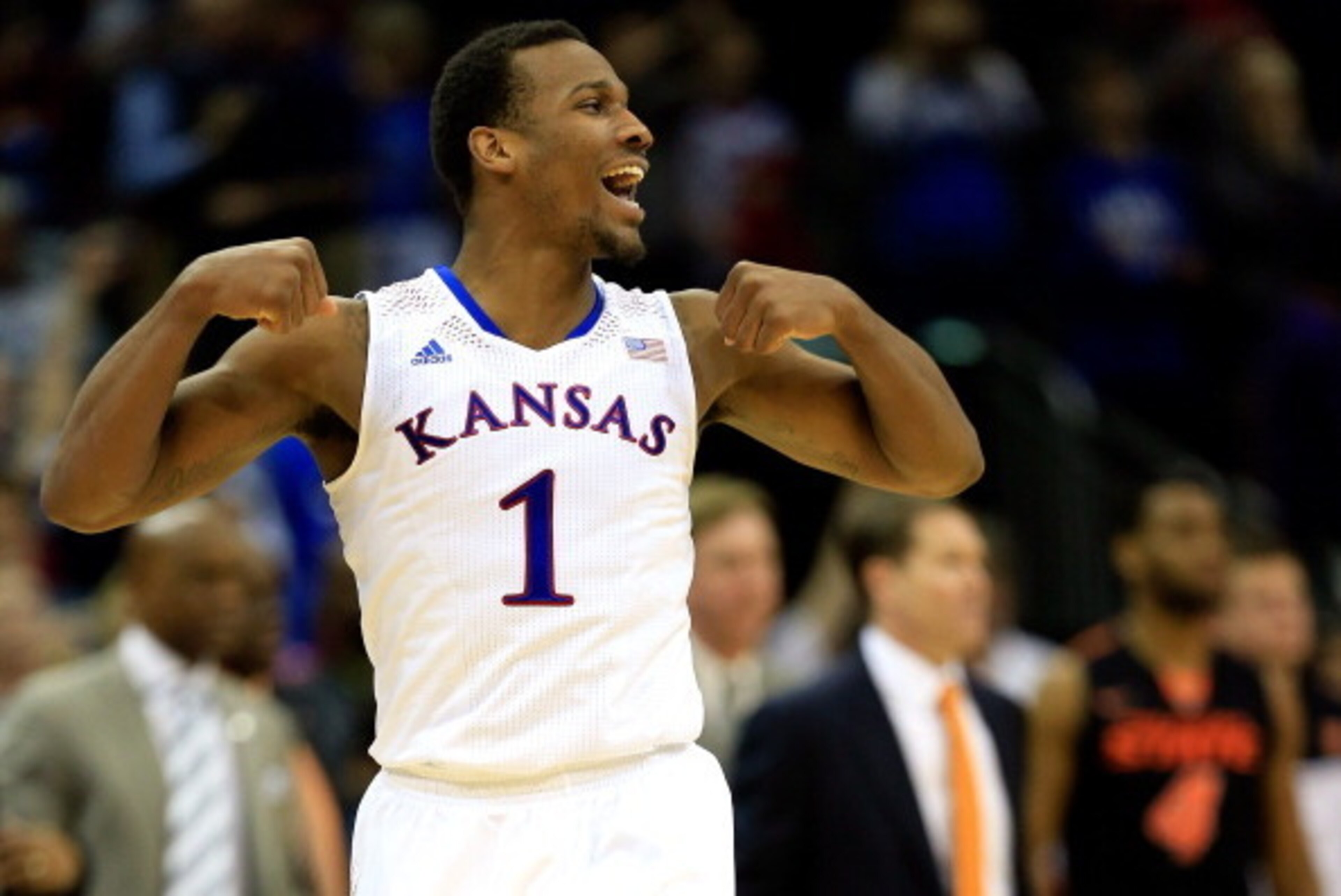 KANSAS CITY, MO - MARCH 13:  Wayne Selden, Jr. #1 of the Kansas Jayhawks celebrates as the Jayahwks defeat the Oklahoma State Cowboys 77-70 to win the Big 12 Basketball Tournament quarterfinal game at Sprint Center on March 13, 2014 in Kansas City, Missou