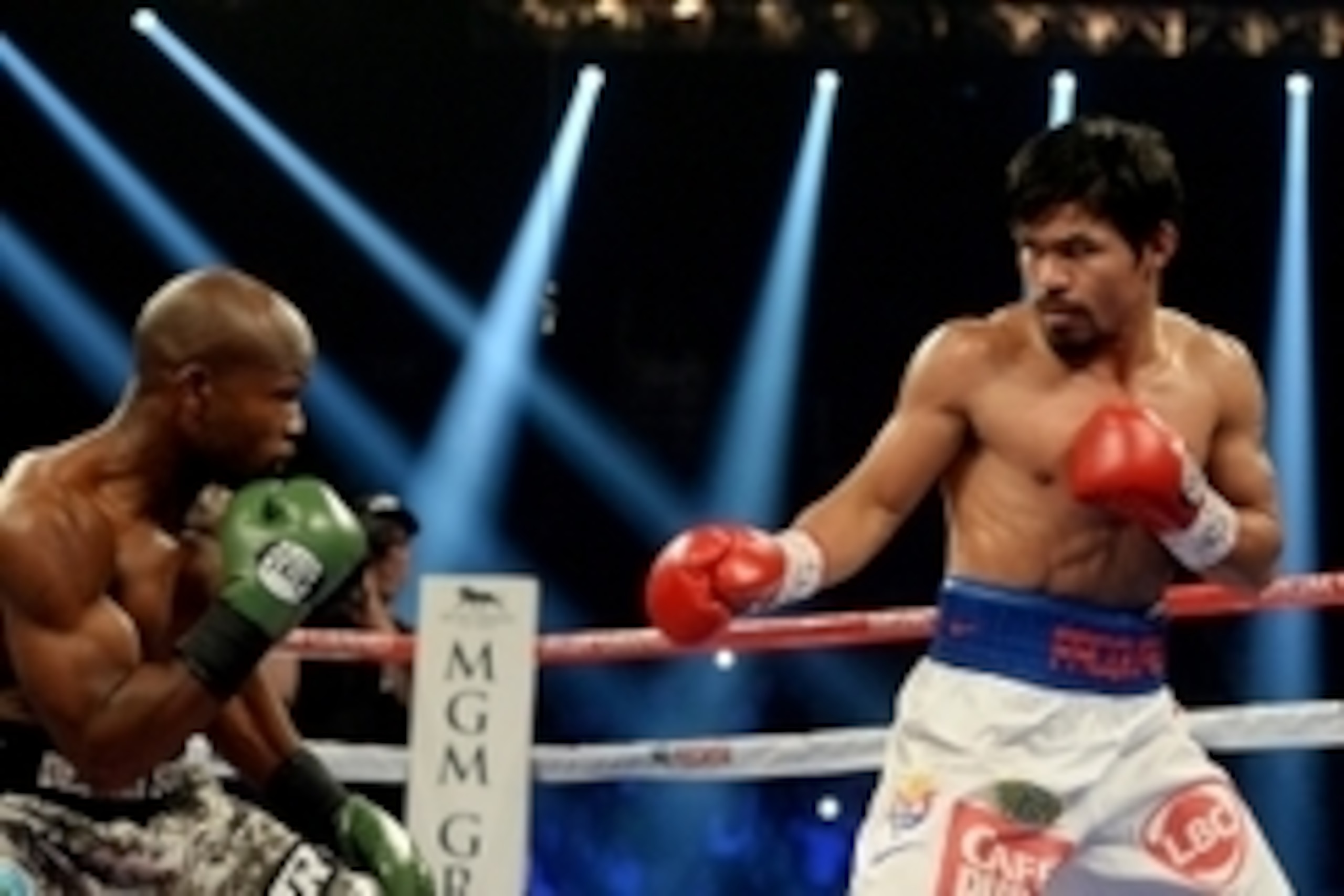 Apr 12, 2014; Las Vegas, NV, USA; Manny Pacquiao (red gloves) and Timothy Bradley Jr. (green gloves) during their WBO World Welterweight Championship fight at MGM Grand Garden Arena. Mandatory Credit: Jayne Kamin-Oncea-USA TODAY Sports