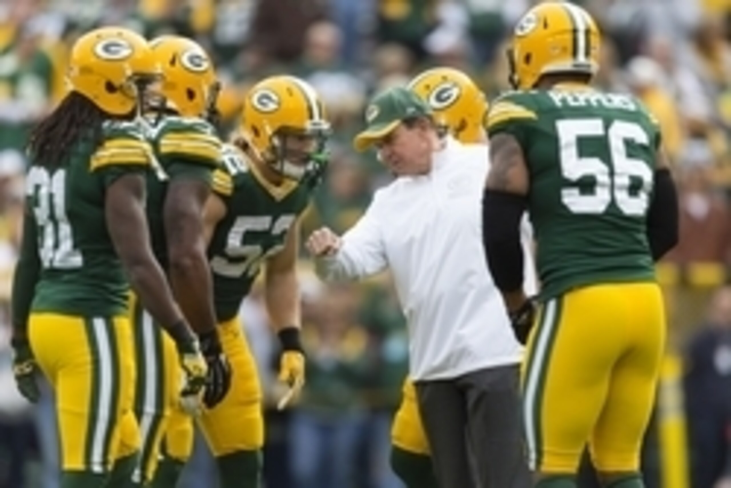 Oct 19, 2014; Green Bay, WI, USA; Green Bay Packers defensive coordinator Dom Capers talks with the defense during warmups prior to the game against the Carolina Panthers at Lambeau Field. Mandatory Credit: Jeff Hanisch-USA TODAY Sports