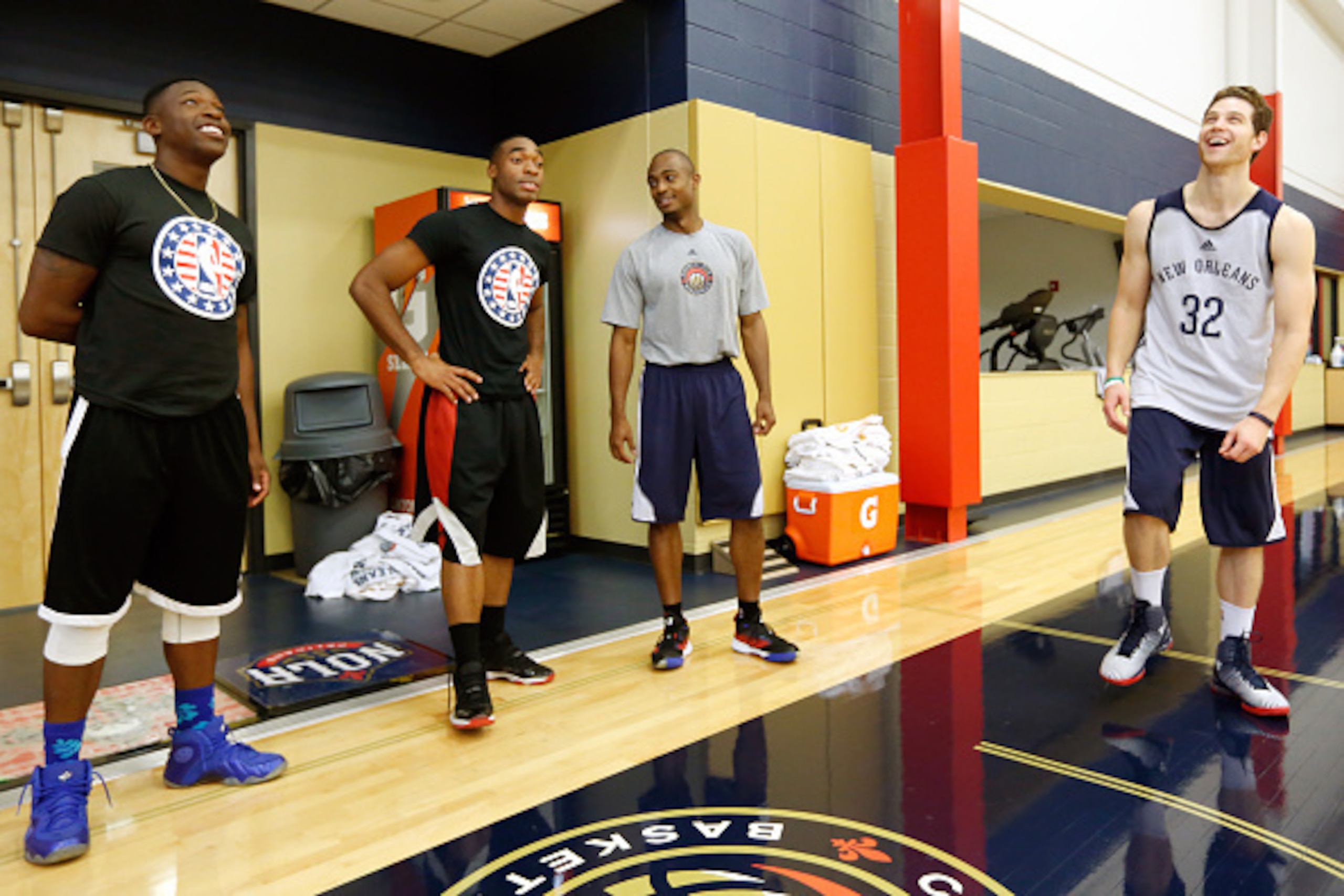 METAIRIE, LA - NOVEMBER 6:  New Orleans Pelicans Jimmer Fredette #32 along with players and coaches host 20 local marines in celebration of NBA Hoops for Troops Week at their practice on November 6, 2014 at the New Orleans practice facility in Metairie, L