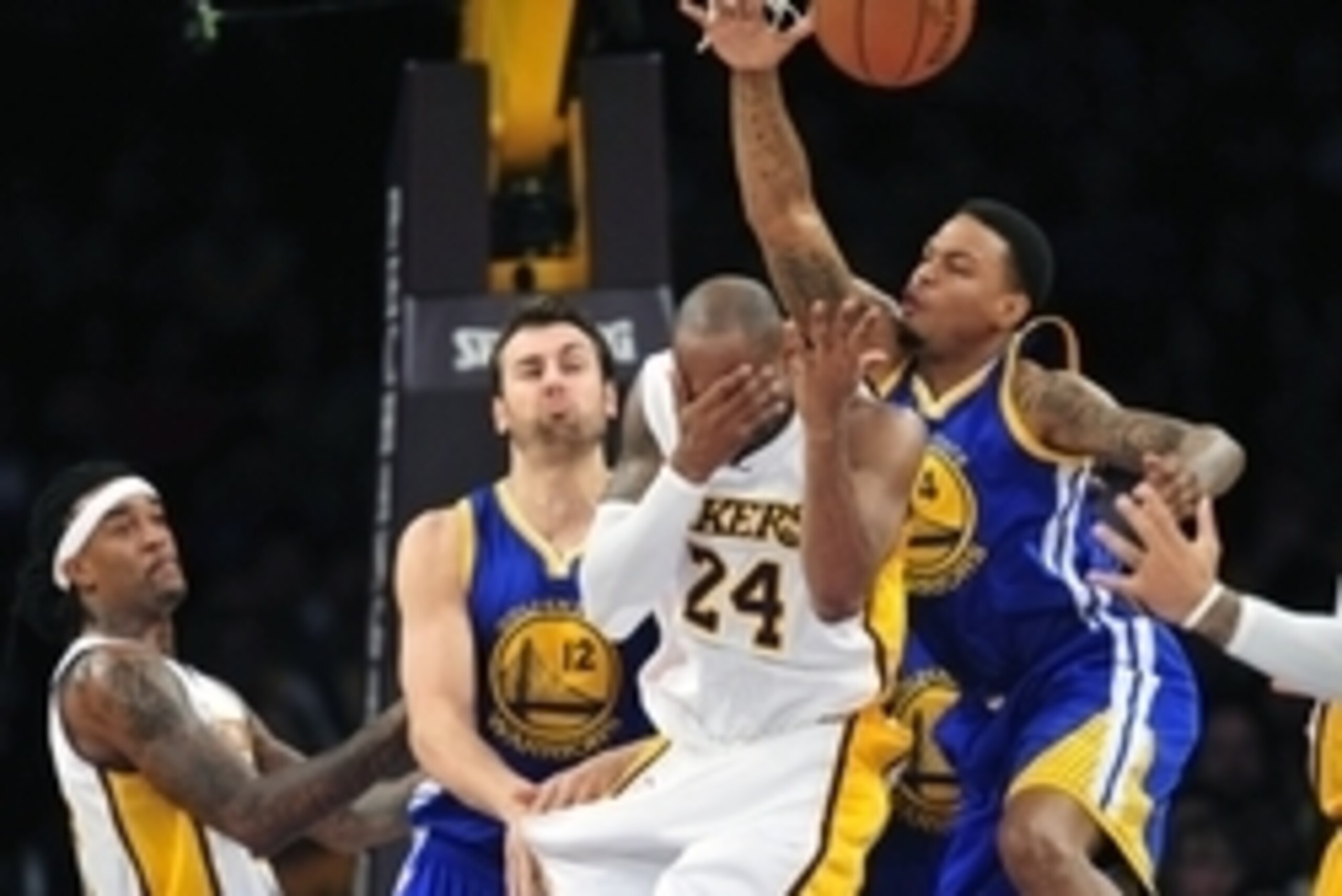 November 16, 2014; Los Angeles, CA, USA; Los Angeles Lakers guard Kobe Bryant (24) suffers an injury during play against the Golden State Warriors in the first half at Staples Center. Mandatory Credit: Gary A. Vasquez-USA TODAY Sports