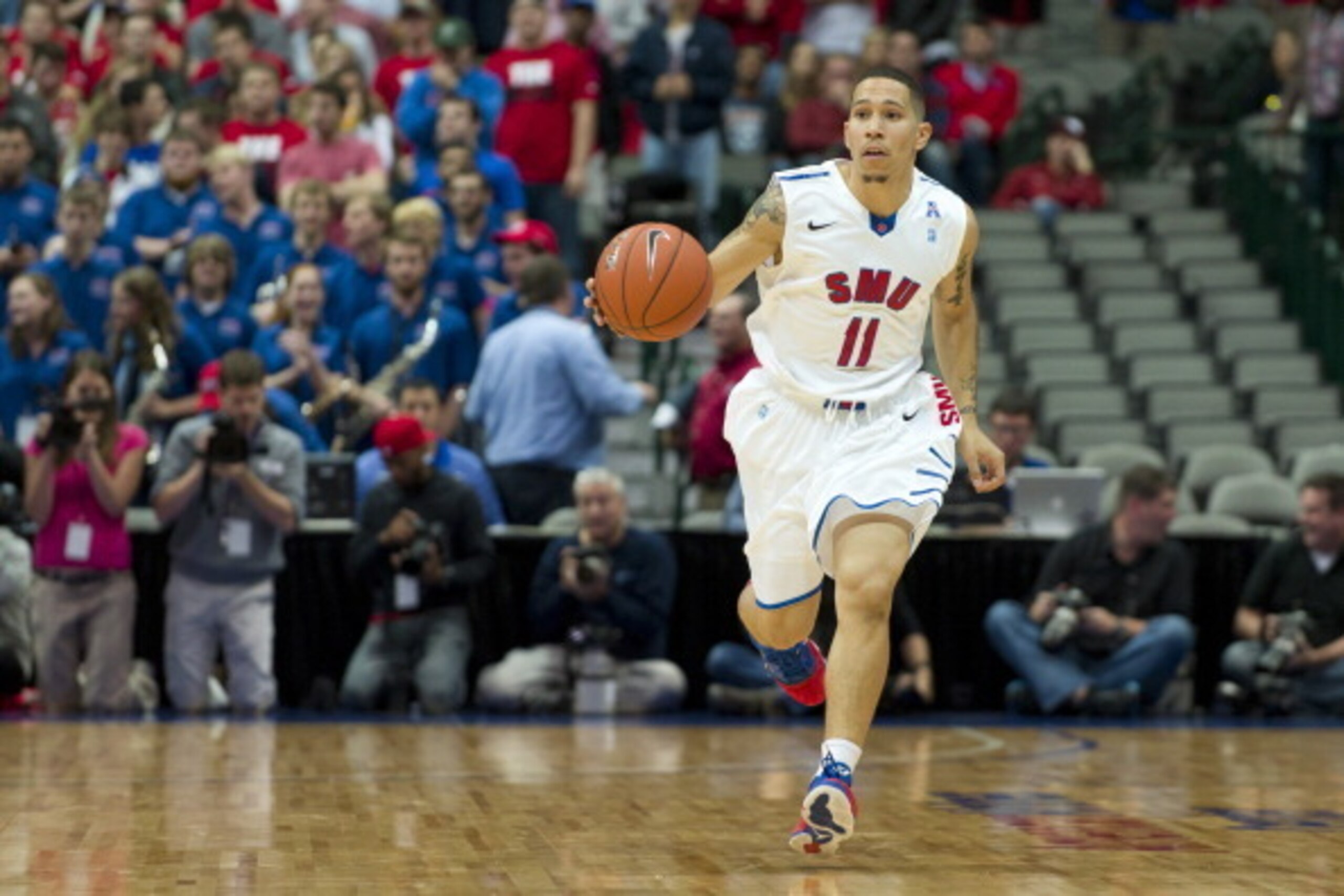 DALLAS, TX - NOVEMBER 8:  Nic Moore #11 of the SMU Mustangs brings the ball upcourt against the TCU Horned Frogs during the Tip-Off Showcase on November 8, 2013 at the American Airlines Center in Dallas, Texas.  (Photo by Cooper Neill/Getty Images)