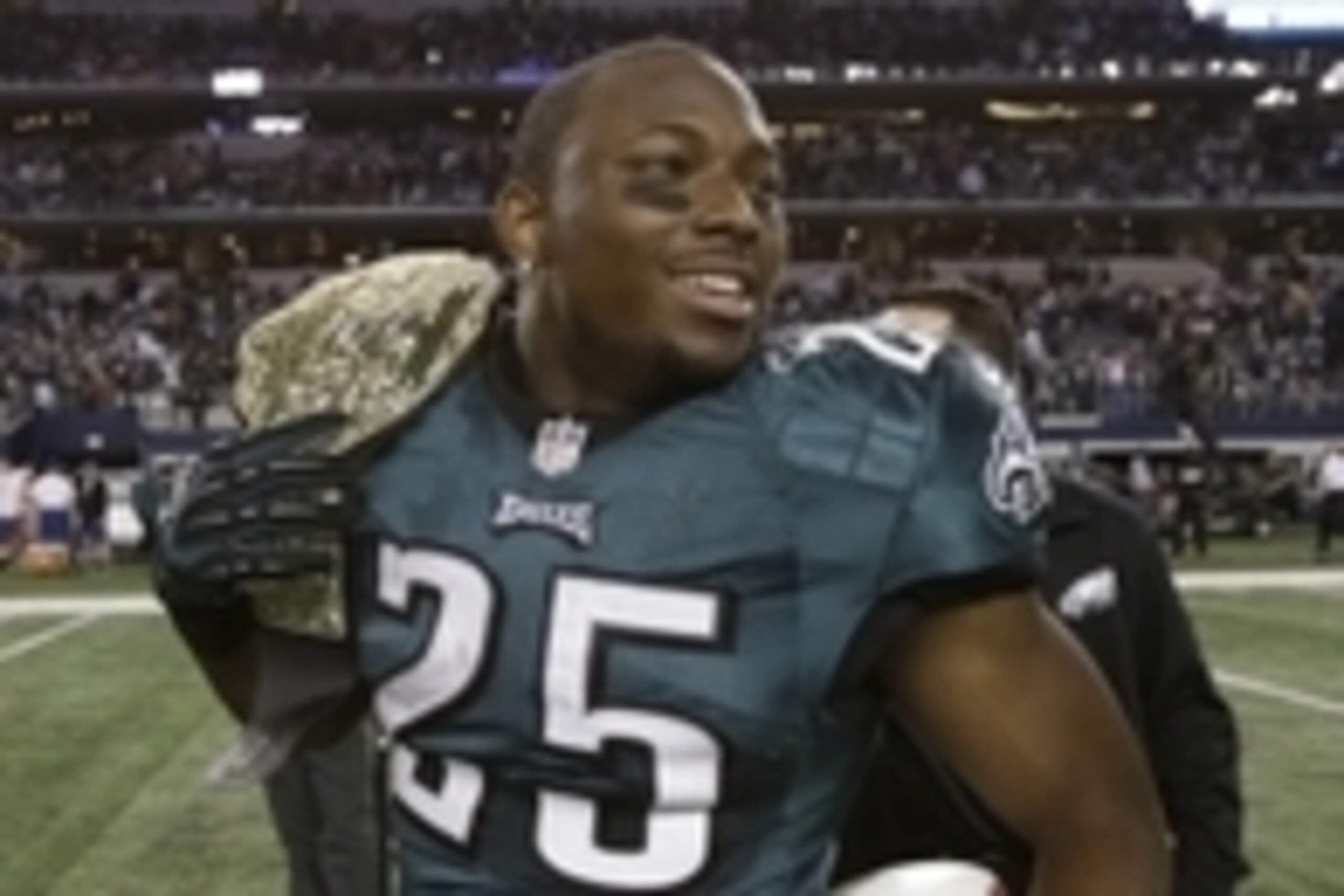 Dec 29, 2013; Arlington, TX, USA; Philadelphia Eagles running back LeSean McCoy (25) walks on the field after the game against the Dallas Cowboys with a belt at AT&T Stadium. The Eagle beat the Cowboys 24-22. Mandatory Credit: Tim Heitman-USA TODAY Sports